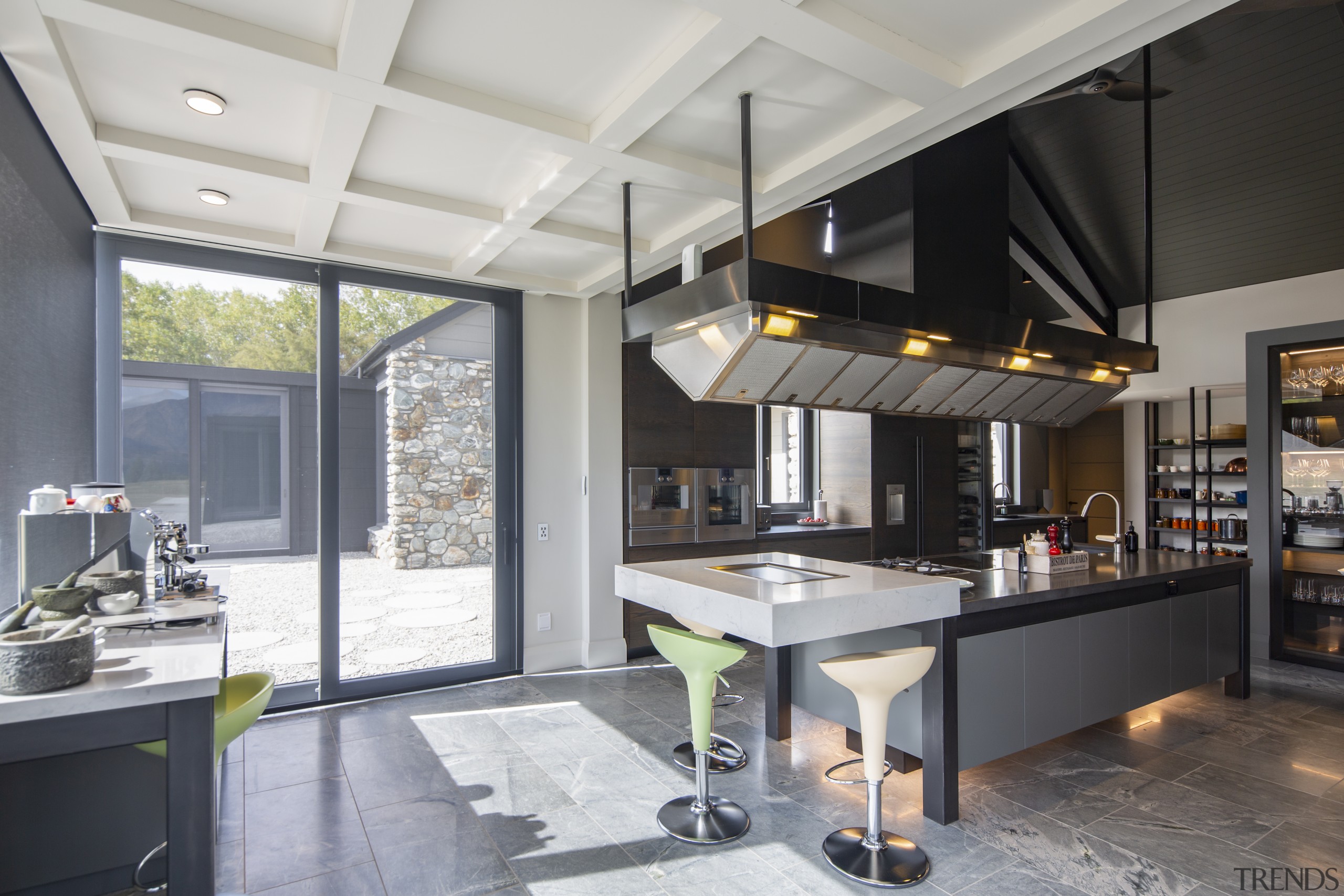 ​​​​​​​Set in a seemingly impossible cantilevered engineered stone gray, black