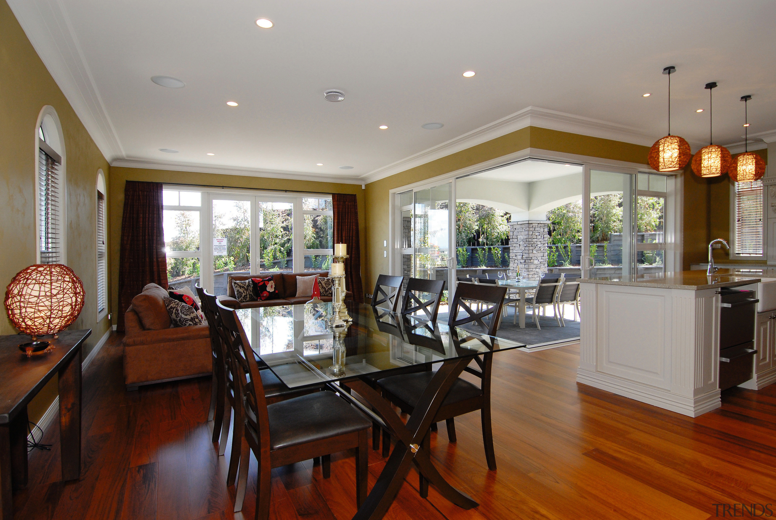 A view of a home designed and built ceiling, dining room, estate, floor, flooring, hardwood, home, interior design, living room, property, real estate, room, window, wood flooring, gray