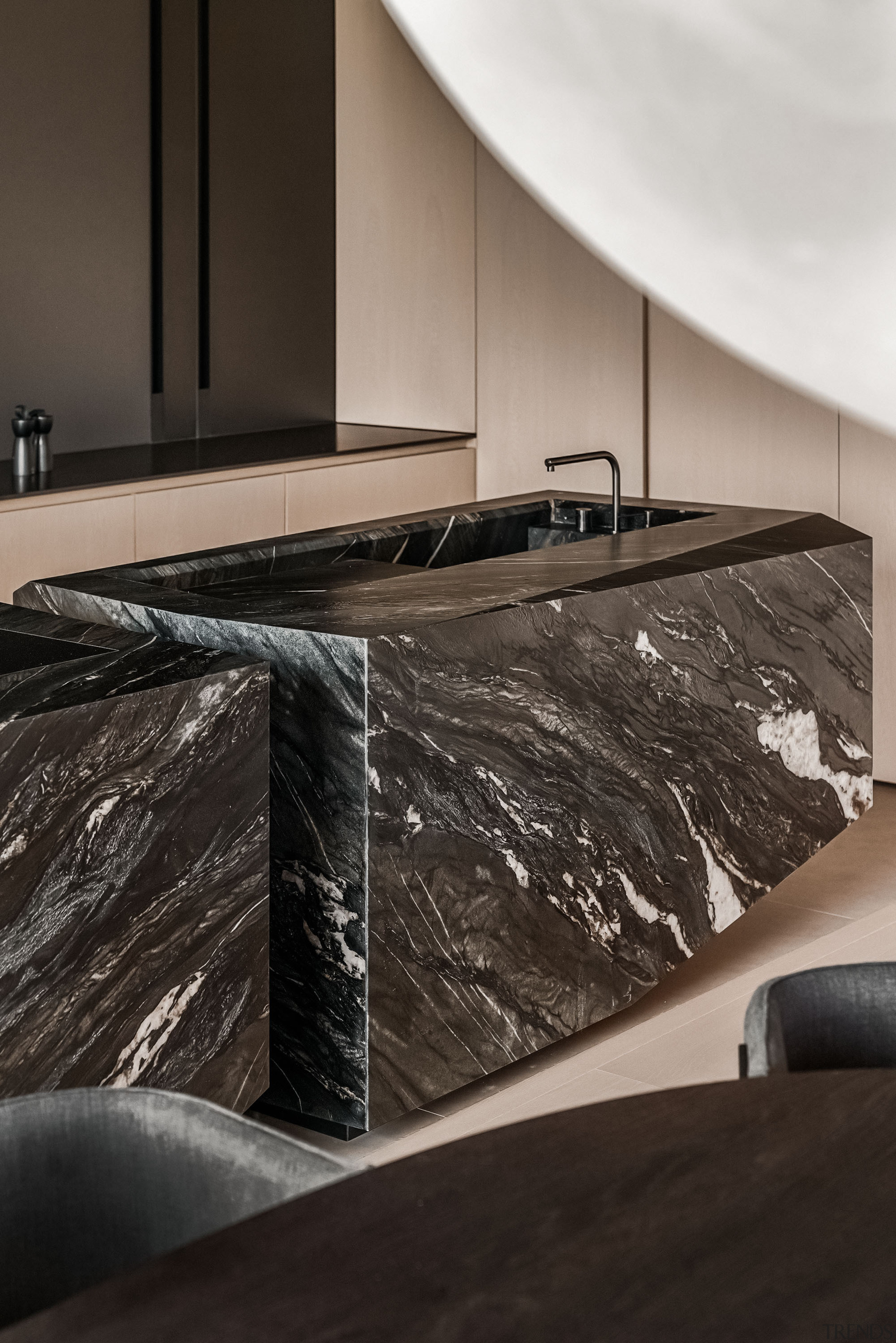 The kitchen's dramatic islands have the look of 