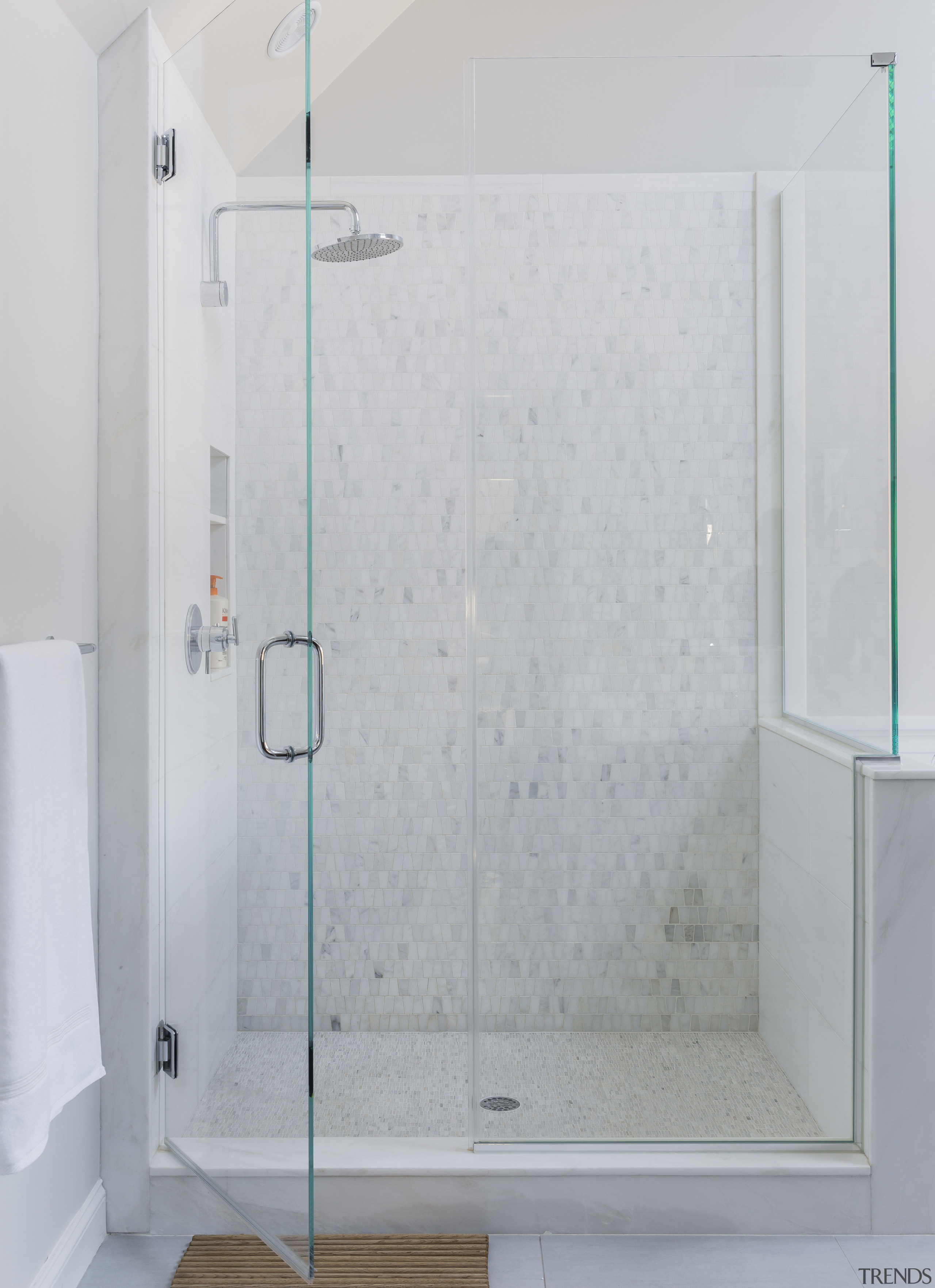 The shower in this white bathroom is lined angle, bathroom, glass, plumbing fixture, shower, shower door, gray