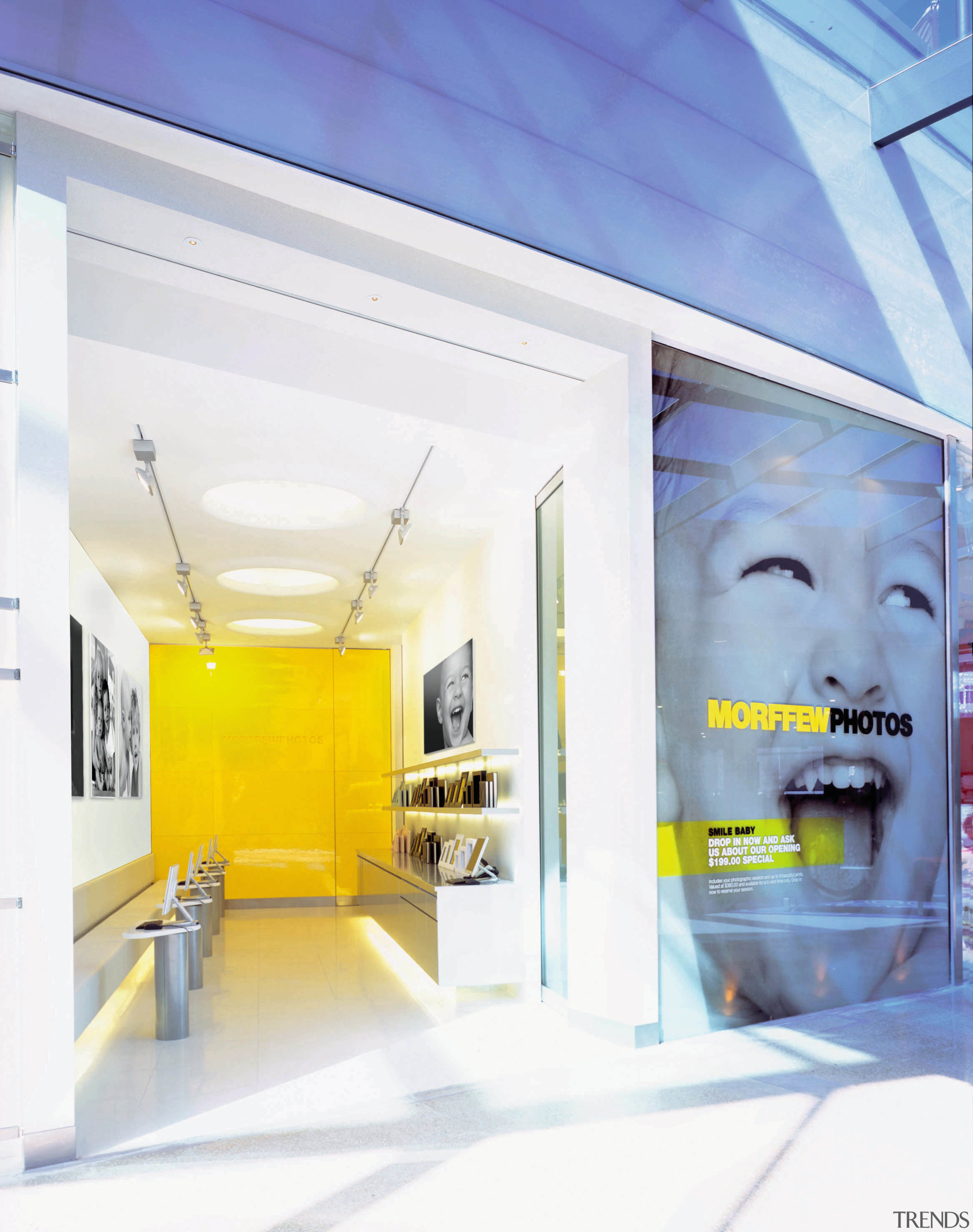 View of a showroom, many photos, many laptops ceiling, interior design, product design, wall, yellow, white