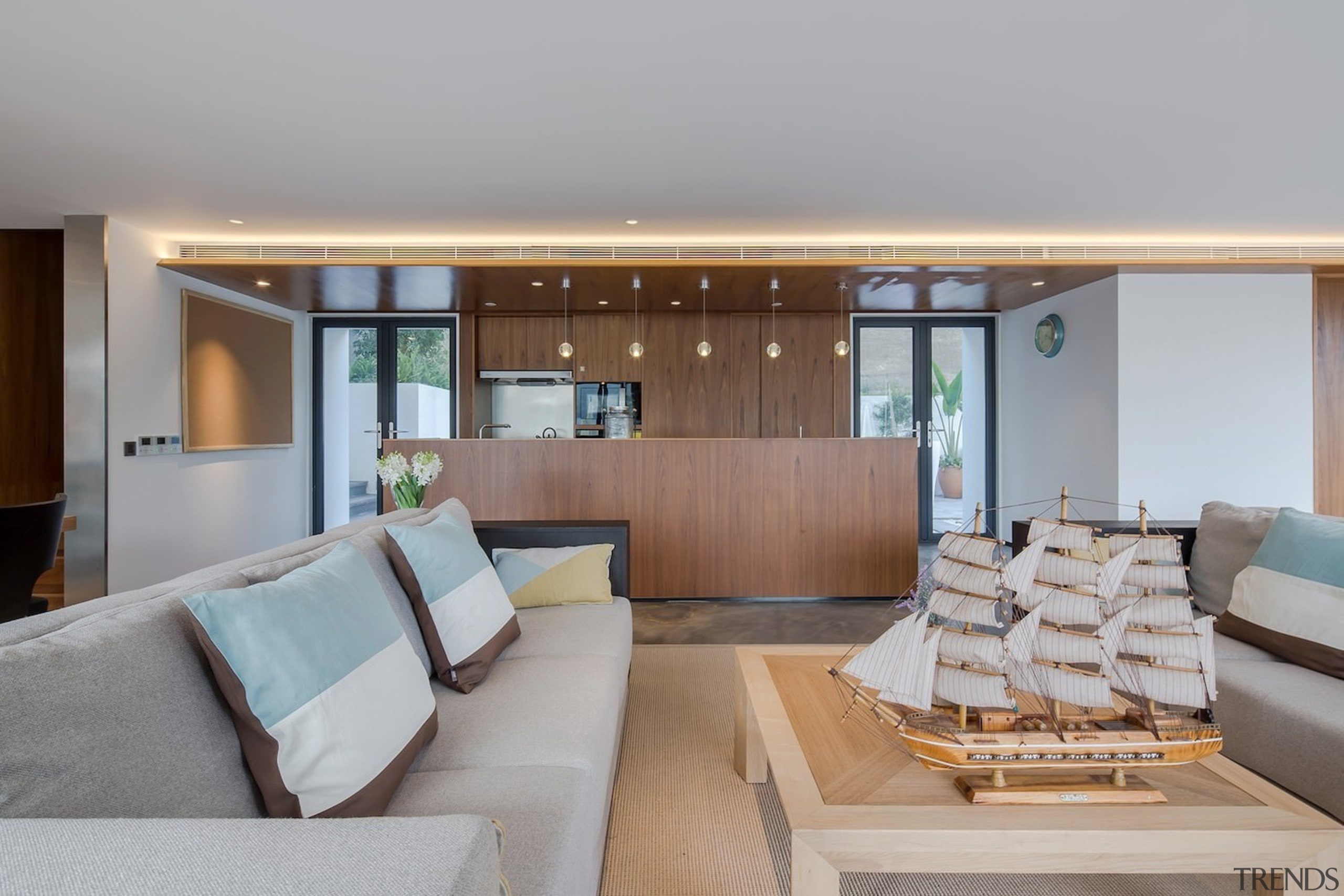 This lounge sits next to the kitchen - architecture, house, interior design, living room, real estate, gray