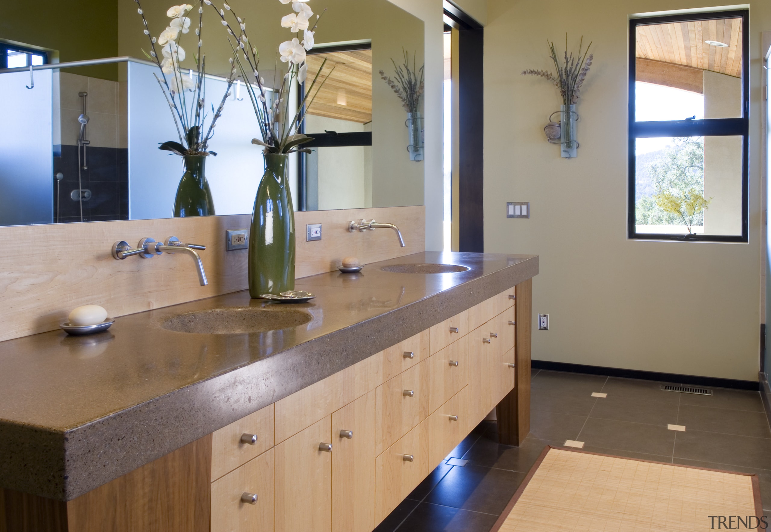 A view of this bathroom featuring tiled flooring, bathroom, cabinetry, countertop, floor, flooring, home, interior design, kitchen, real estate, room, sink, brown, gray