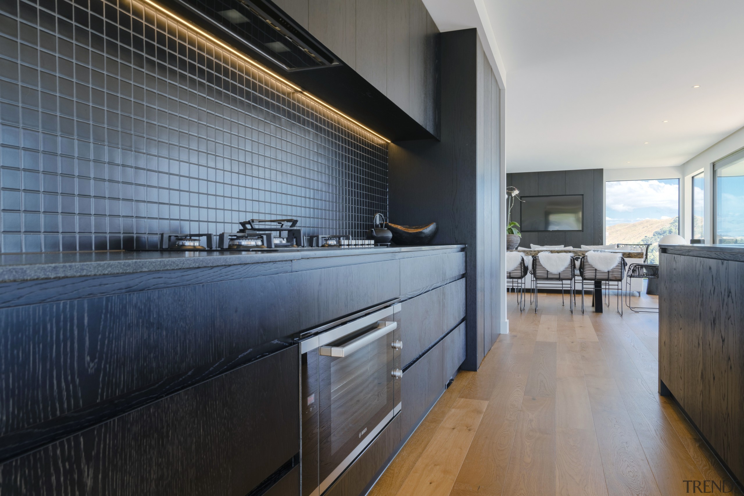 ​​​​​​​Concealed LED lighting washes down the tile splashback 