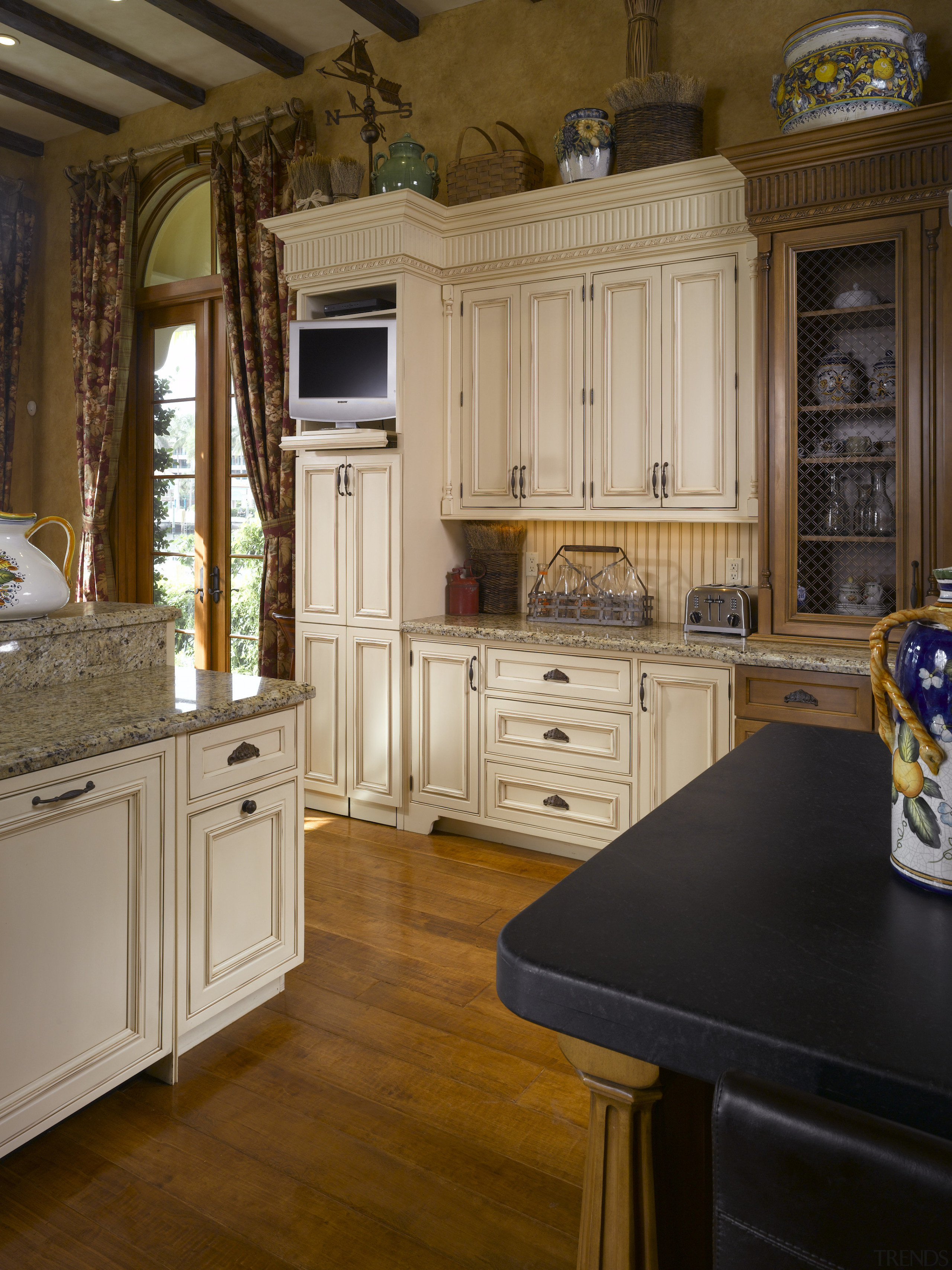 Modern appliances are mostly concealed within the cabinetry. cabinetry, countertop, cuisine classique, floor, flooring, furniture, hardwood, home, interior design, kitchen, room, wall, wood, wood flooring, wood stain, brown