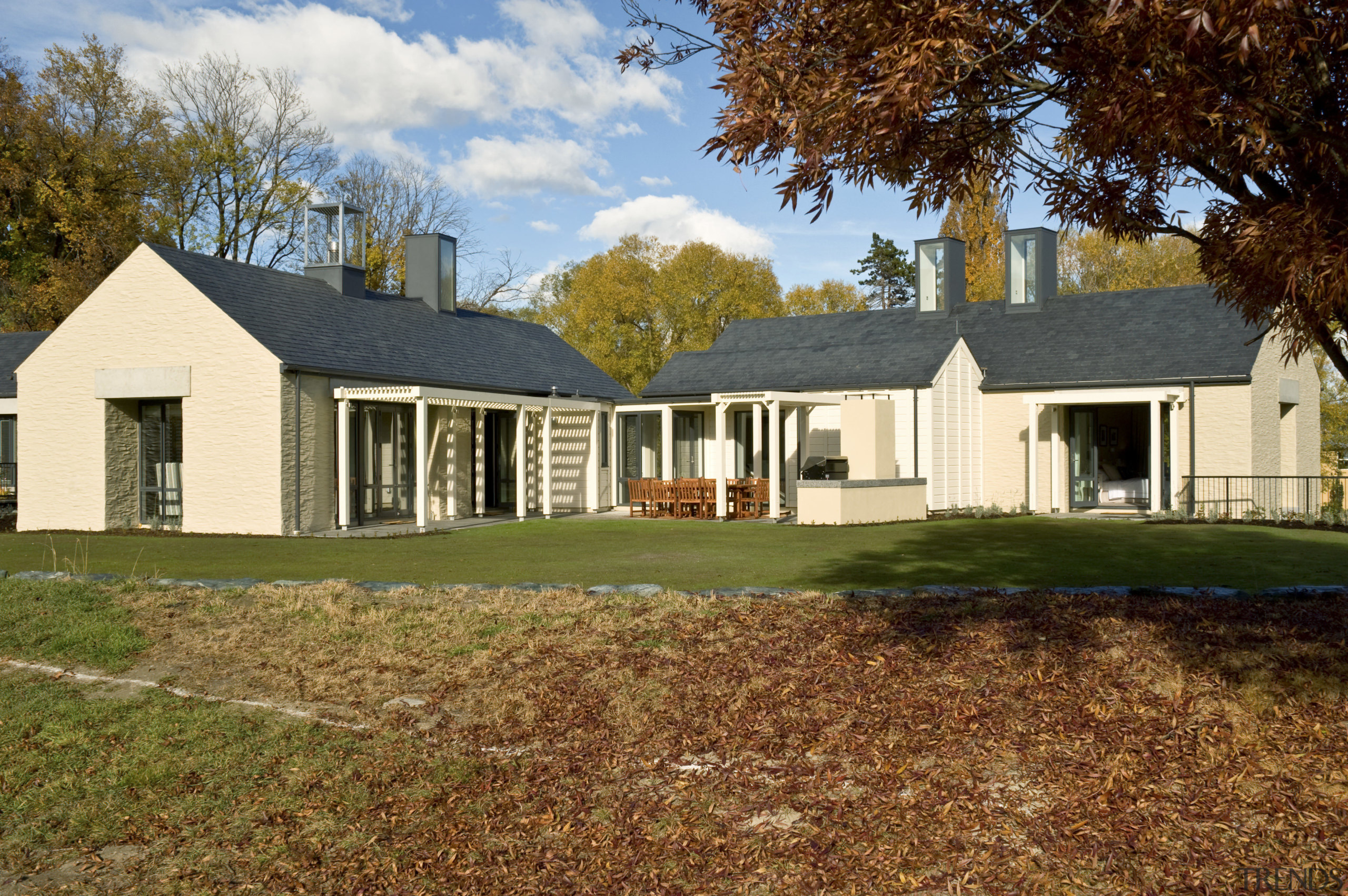 This home by Michael Wyatt reflects the style cottage, elevation, estate, facade, farmhouse, grass, home, house, landscape, lawn, plantation, property, real estate, residential area, siding, yard, brown