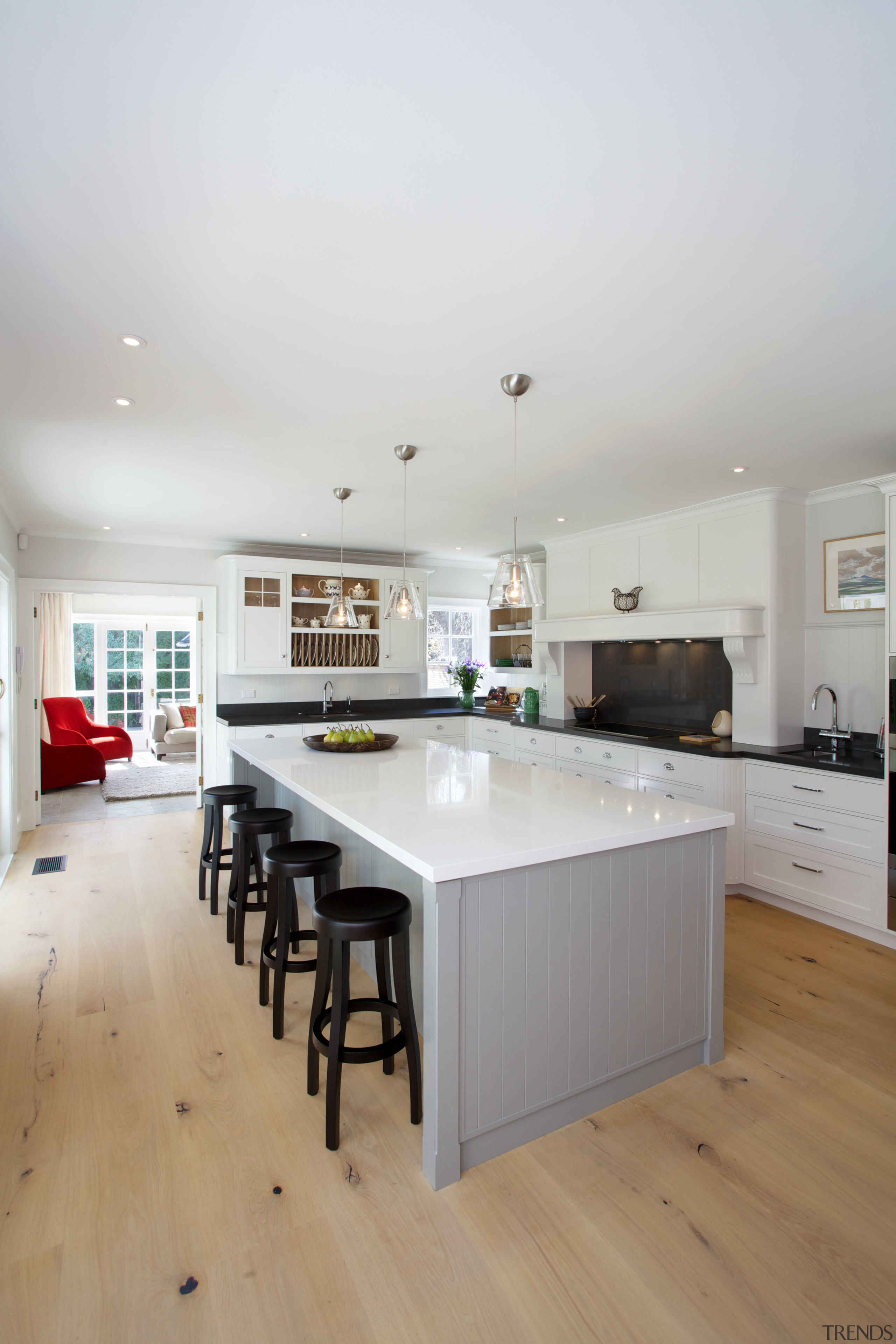 In this kitchen by Davinia Sutton, most cabinetry cabinetry, countertop, cuisine classique, floor, flooring, hardwood, home, house, interior design, kitchen, real estate, room, wood flooring, gray, white