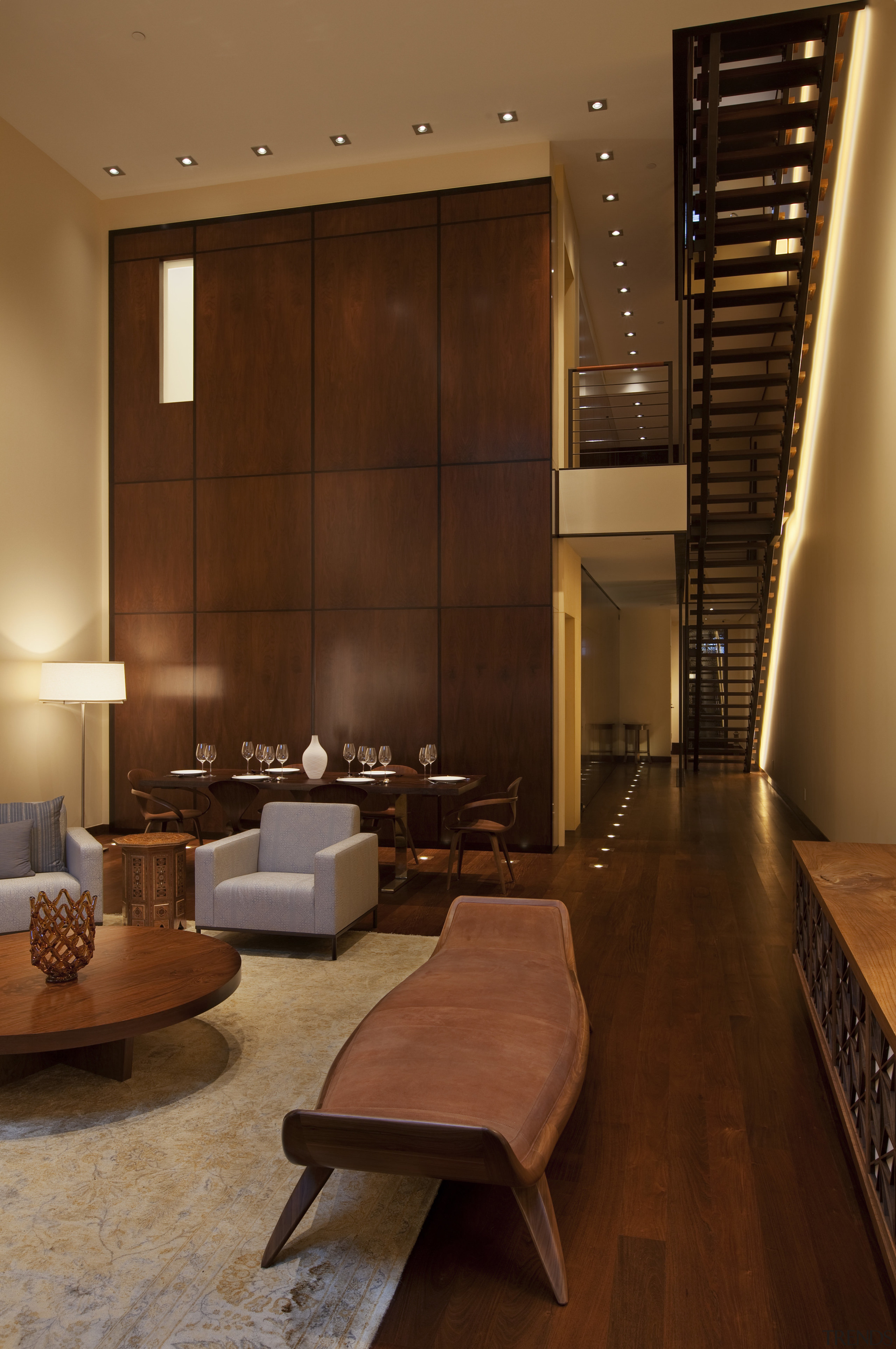 View of lounge and flights of stairs. - architecture, ceiling, floor, flooring, hardwood, interior design, lighting, living room, lobby, room, wall, wood, wood flooring, brown