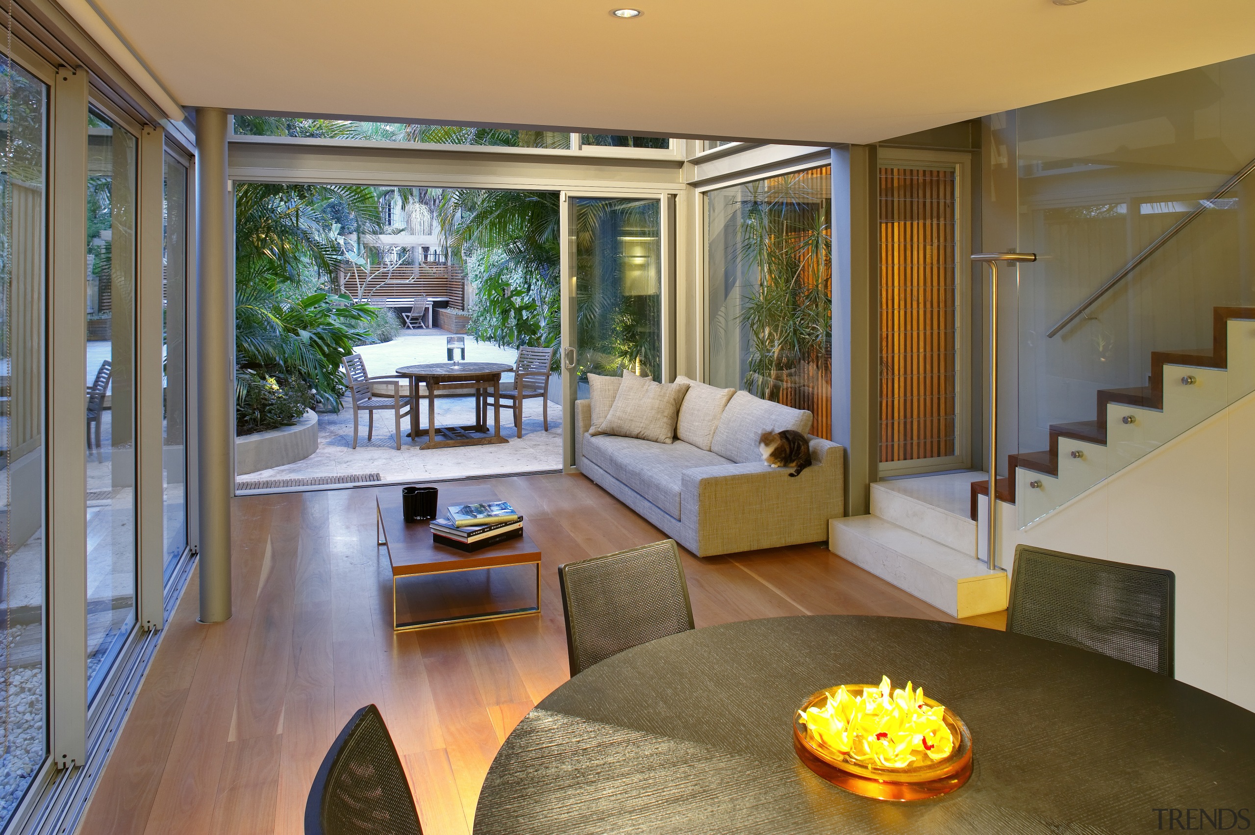 A glazed, three-storey atrium fills this home with architecture, estate, home, house, interior design, living room, real estate, room, window, brown, gray