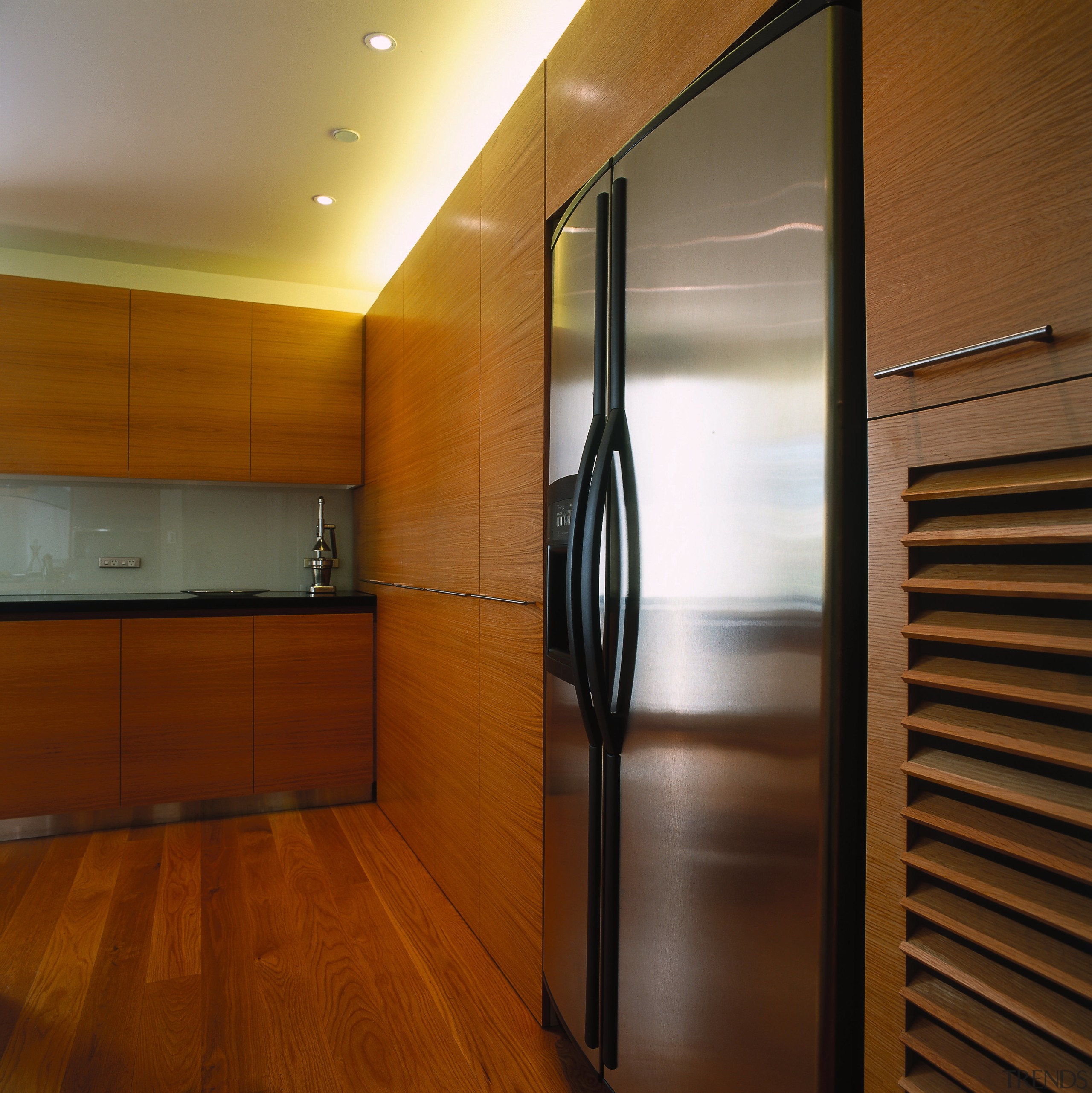 view of stainless steel refrigeration unit and american architecture, cabinetry, ceiling, floor, flooring, hardwood, interior design, lighting, room, wood, wood flooring, brown