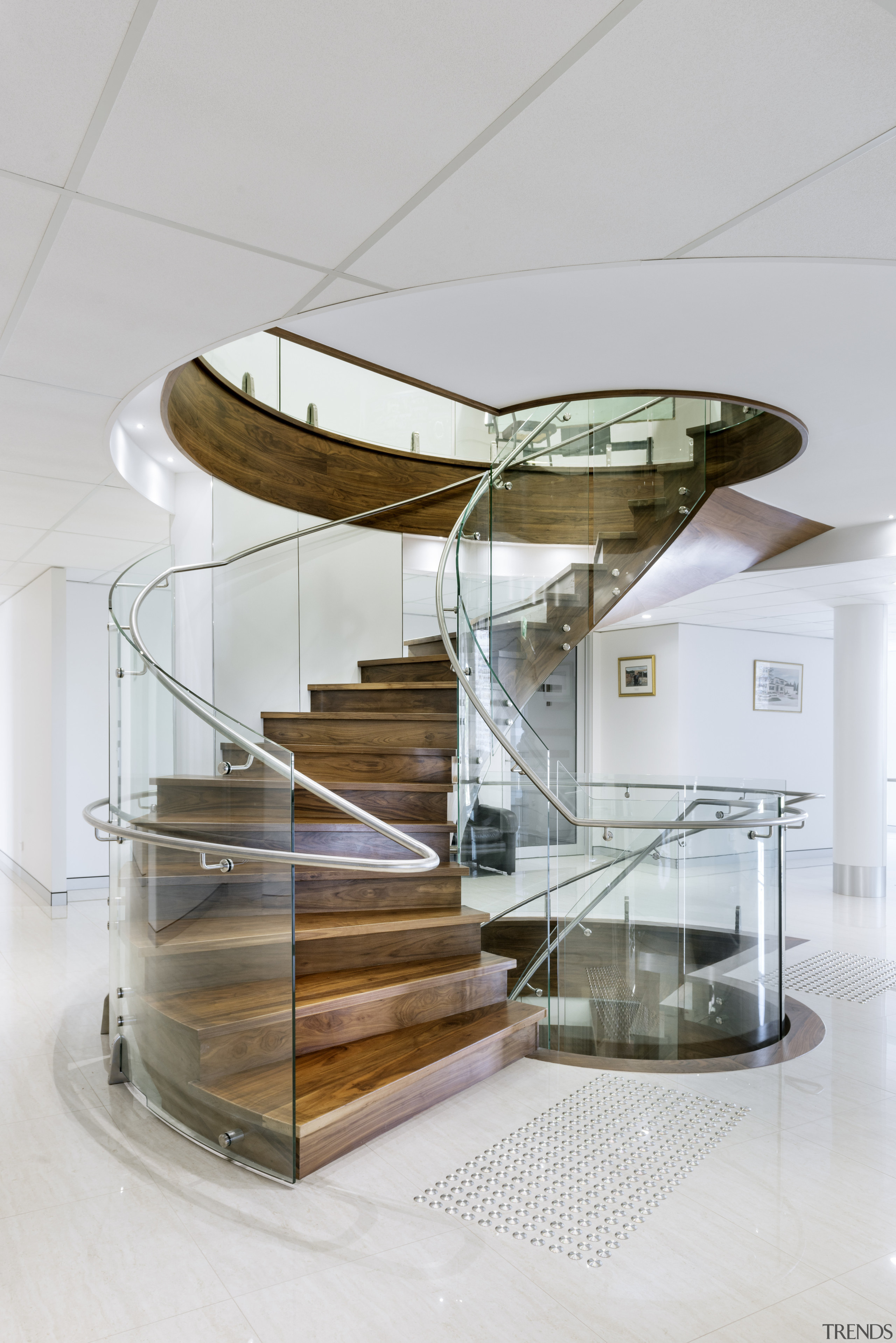 Tight curves in the glass balustrade help make furniture, glass, interior design, product design, stairs, table, gray, white