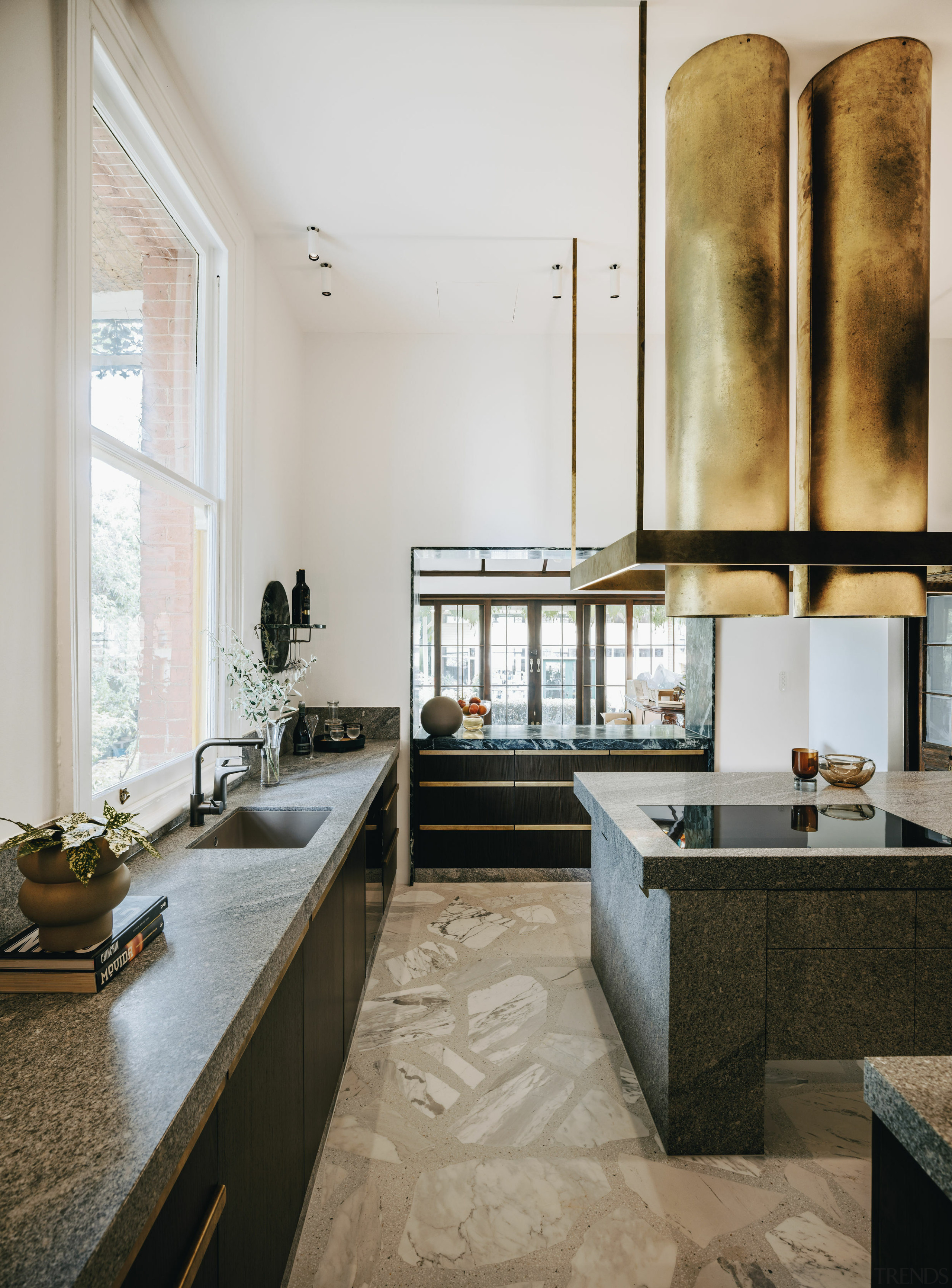 Kitchen view towards the servery and adjoining living 