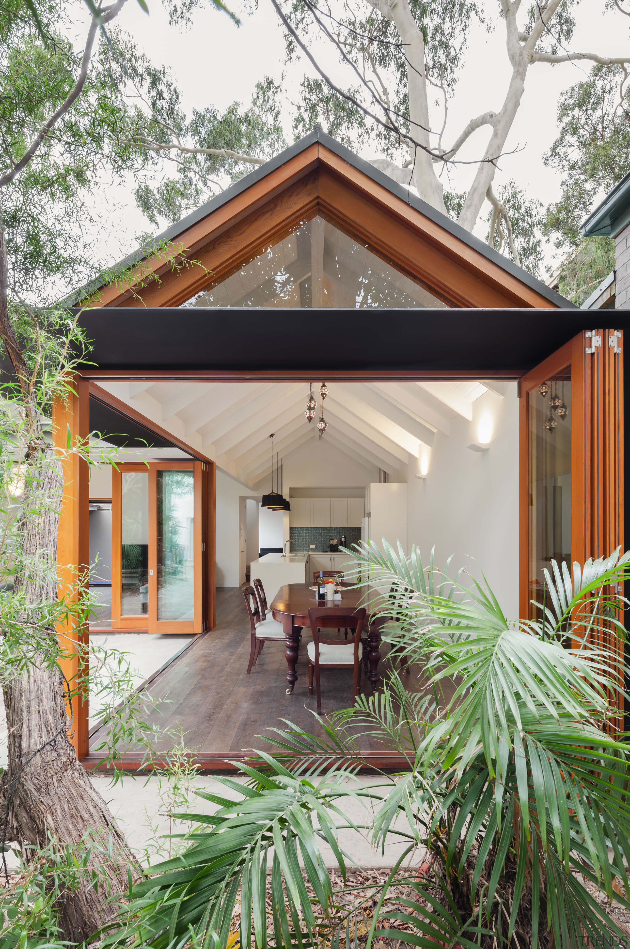 Reminiscent of a Japanese courtyard house, this house architecture, backyard, cottage, facade, home, house, outdoor structure, property, real estate, siding, yard, white