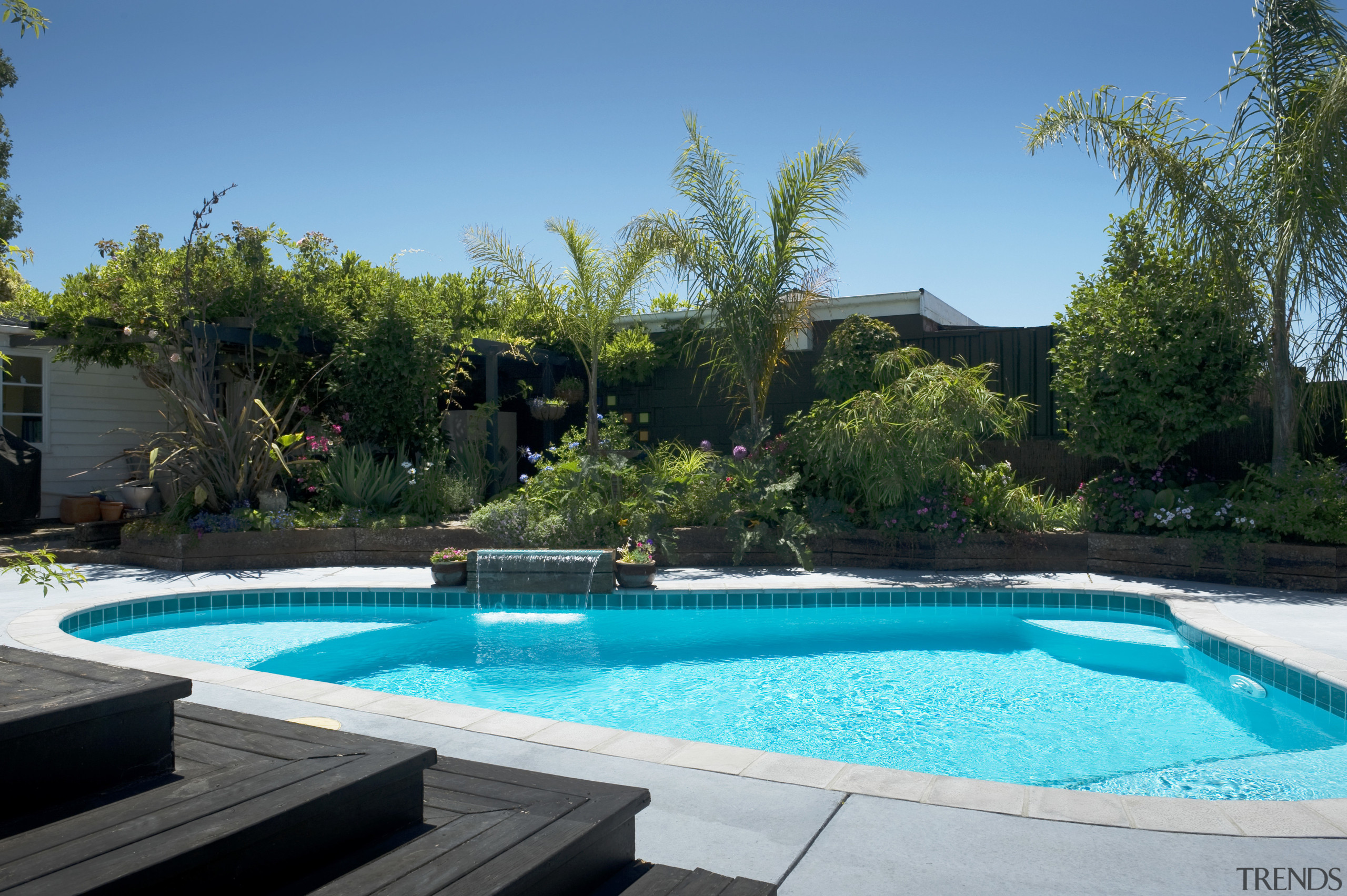 view a pool built and designed by Pool backyard, estate, home, house, landscape, landscaping, leisure, plant, property, real estate, resort, swimming pool, tree, villa, water, water feature, yard, teal