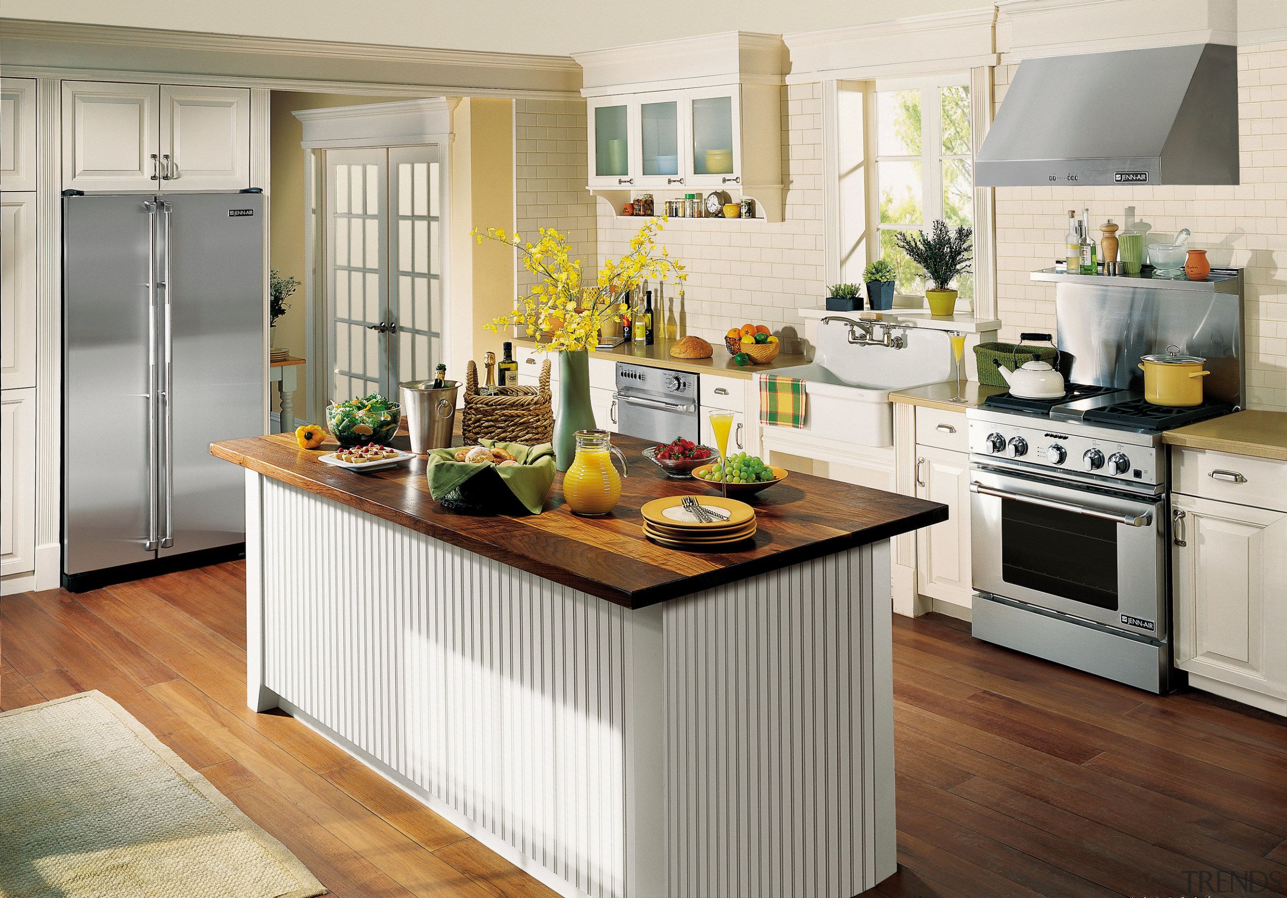 A view of this kitchen featuring the latest cabinetry, countertop, cuisine classique, floor, flooring, hardwood, interior design, kitchen, white