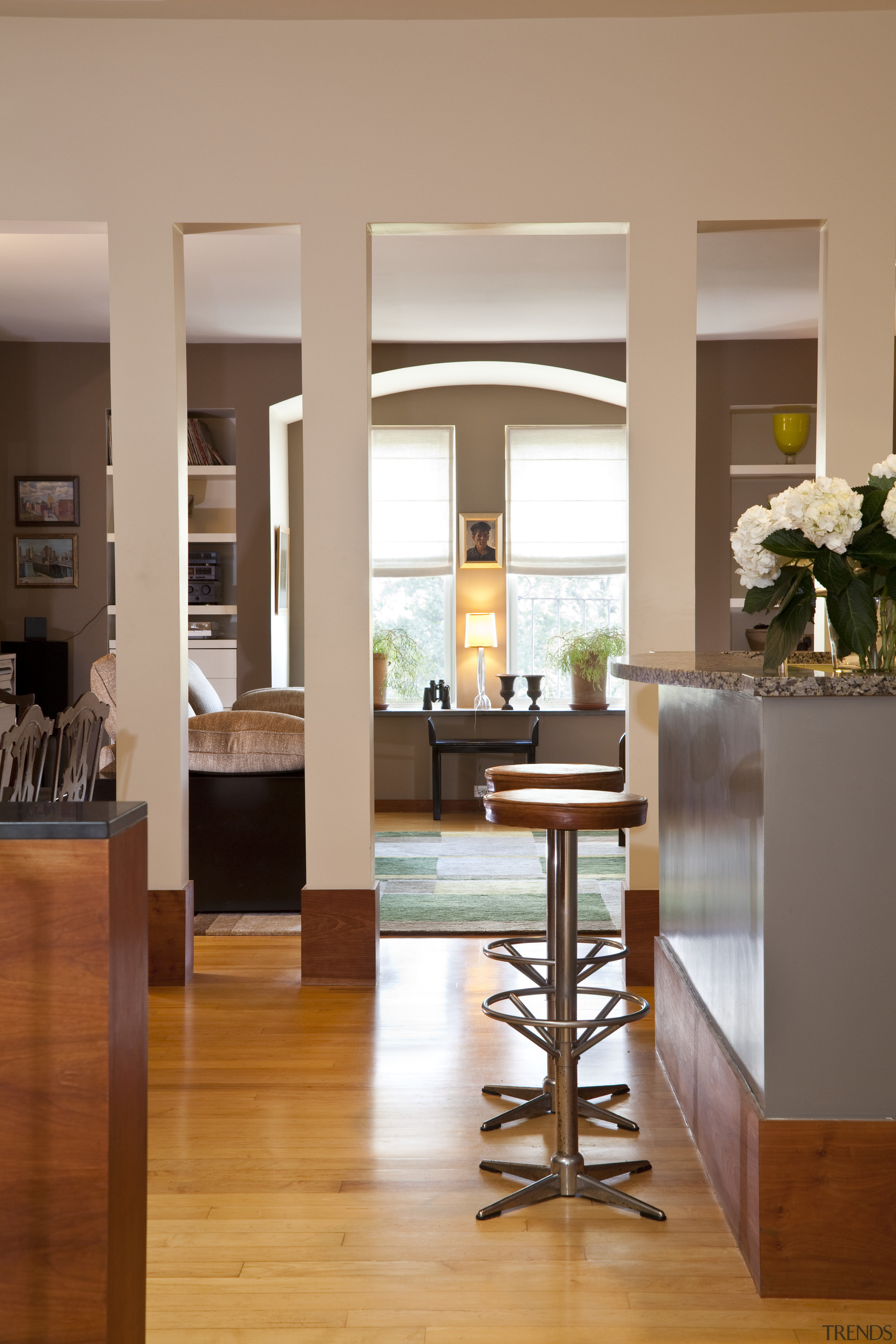 View of this contemporary home remodeled by Eleven dining room, floor, flooring, furniture, hardwood, home, interior design, living room, lobby, table, window, wood, wood flooring, orange, brown