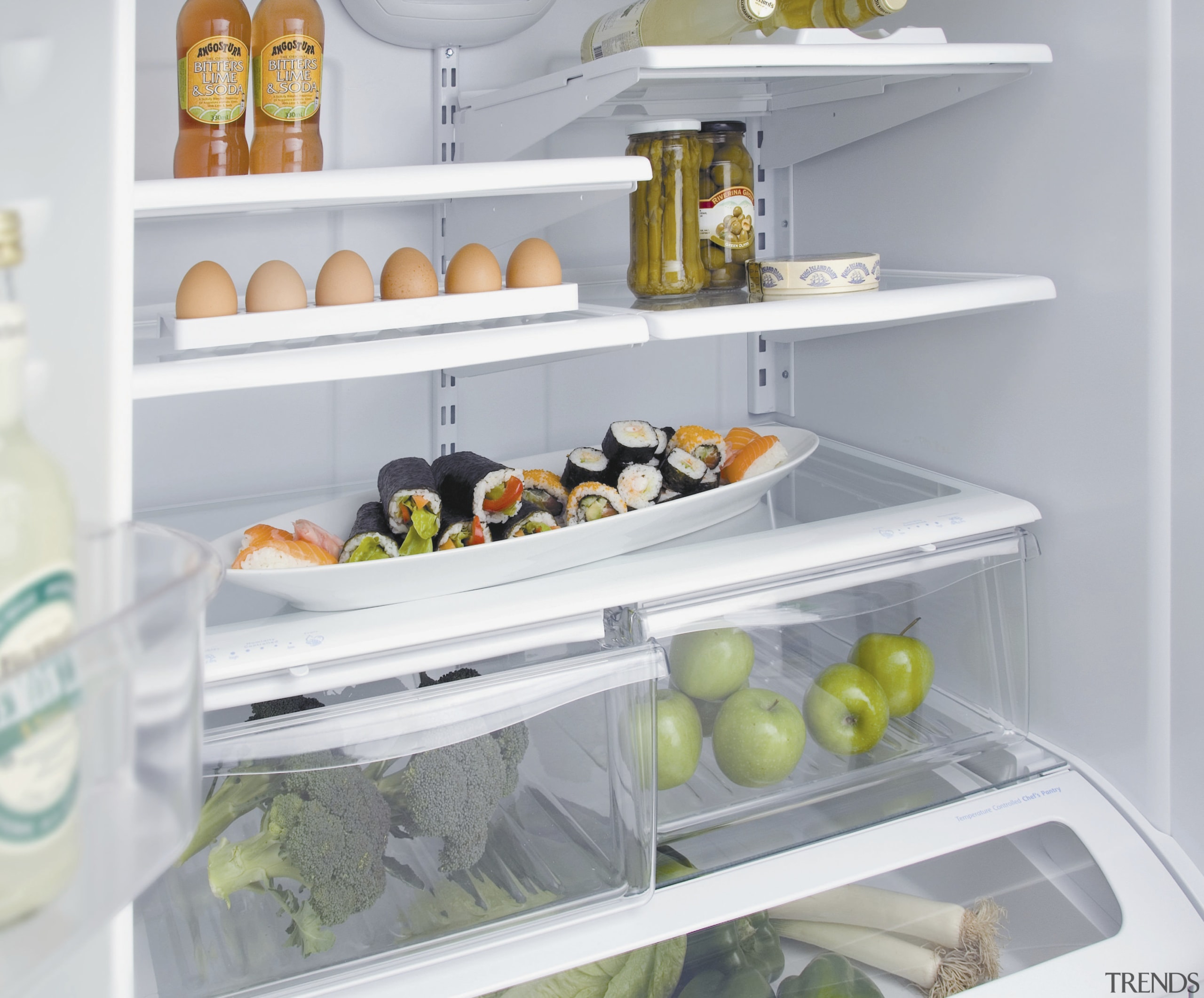 A view of some kitchen appliances by Maytag. display case, home appliance, kitchen, kitchen appliance, major appliance, produce, product, refrigerator, shelf, small appliance, gray, white