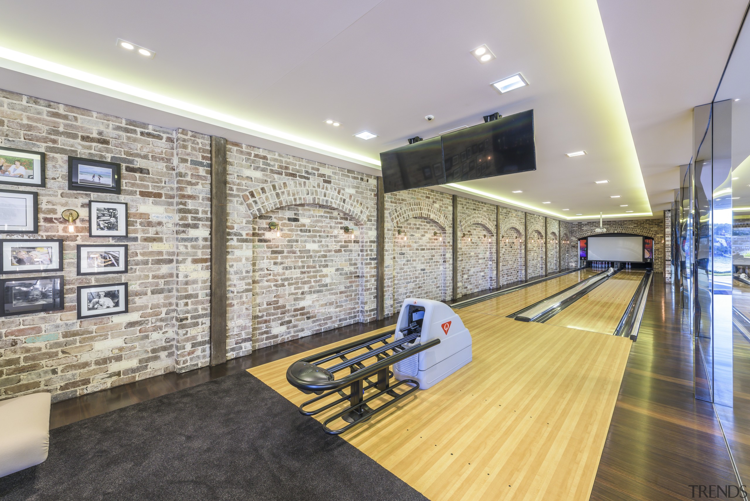 A full-size bowling alley is just one of ceiling, floor, flooring, interior design, leisure centre, lobby, real estate, gray