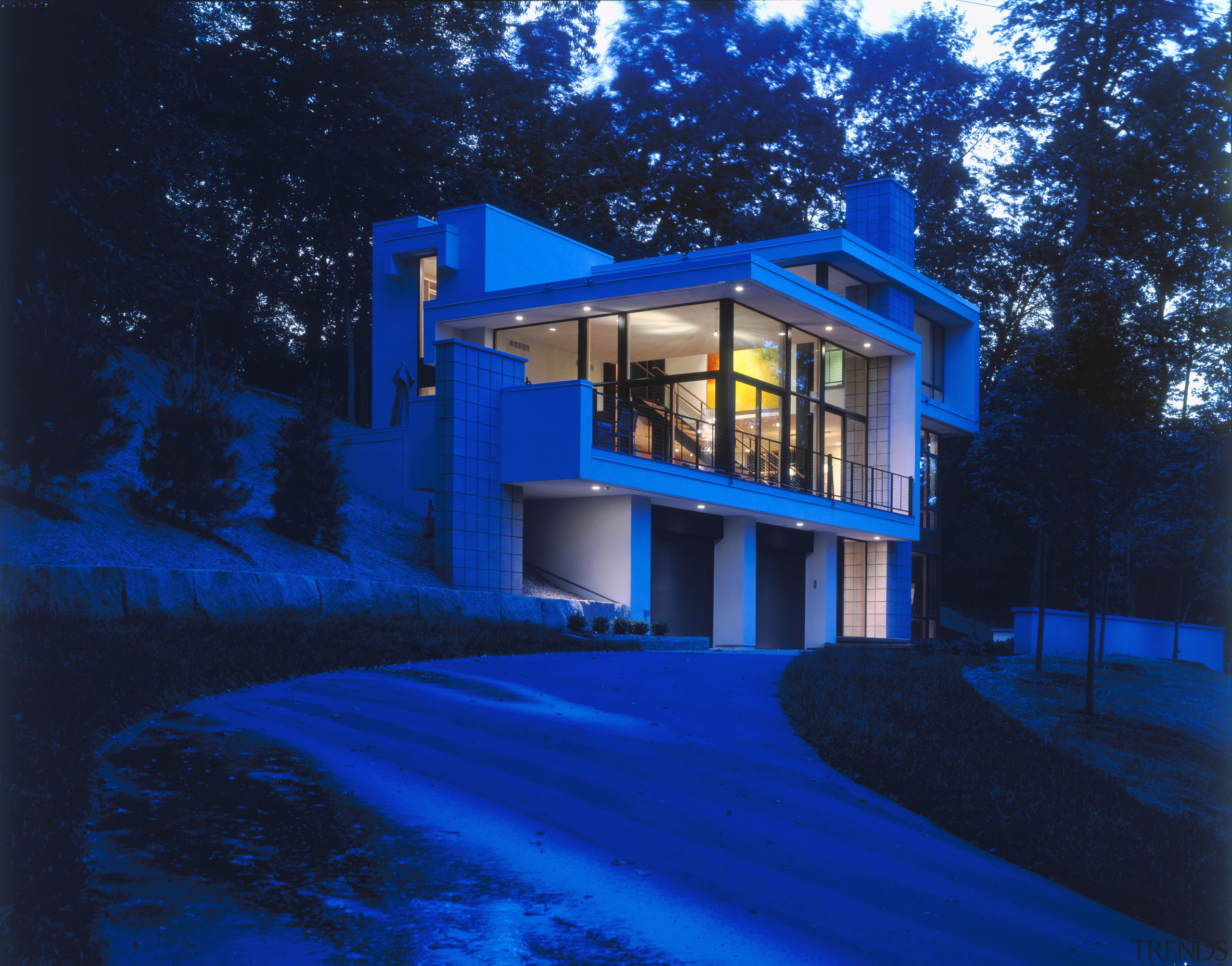 View of a house designed by Charles R architecture, blue, building, estate, evening, facade, home, house, landscape lighting, light, lighting, majorelle blue, night, property, real estate, residential area, sky, window, blue