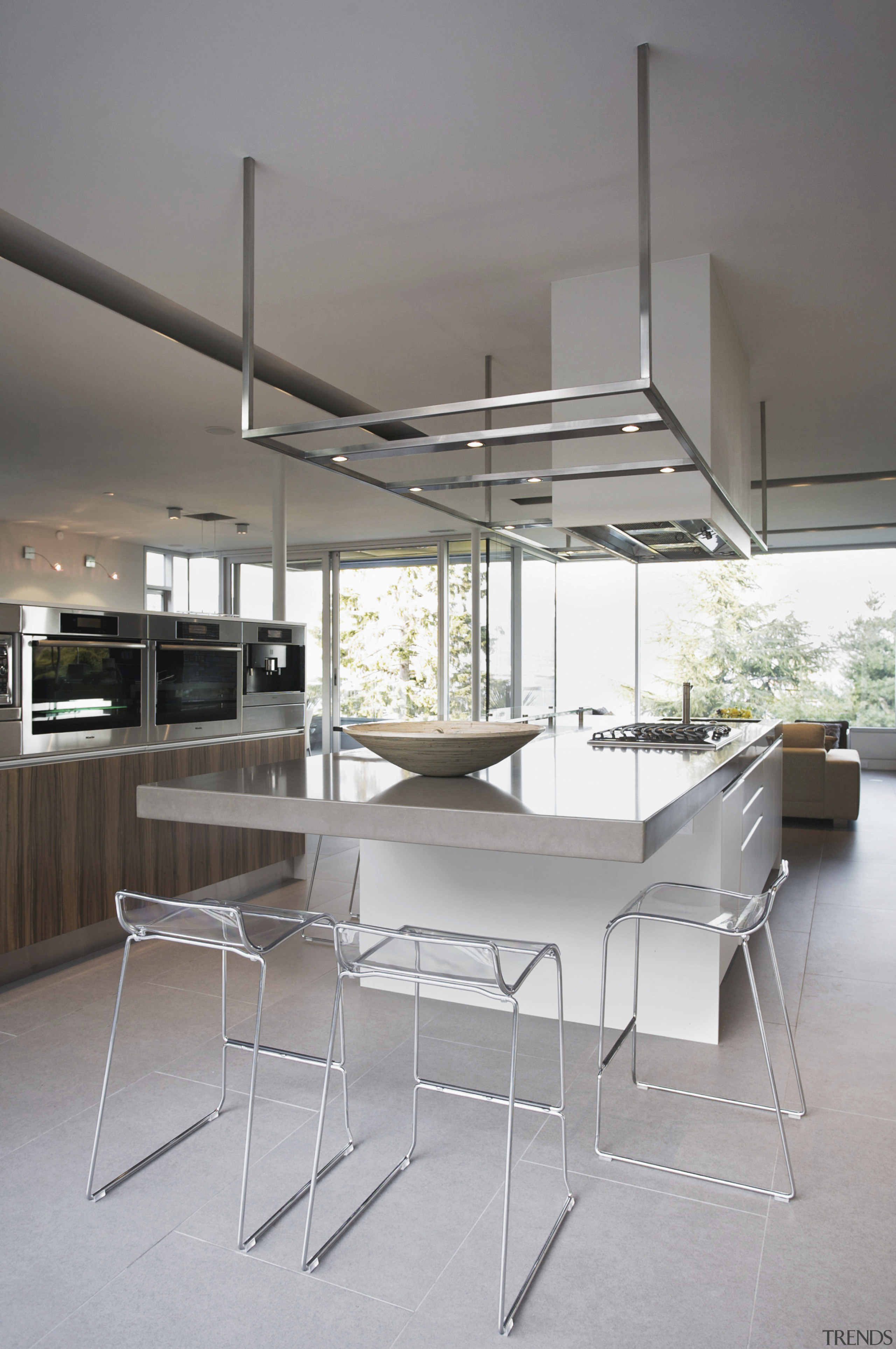 View of contemporay kitchen with light toned island. architecture, chair, furniture, house, interior design, product design, table, gray