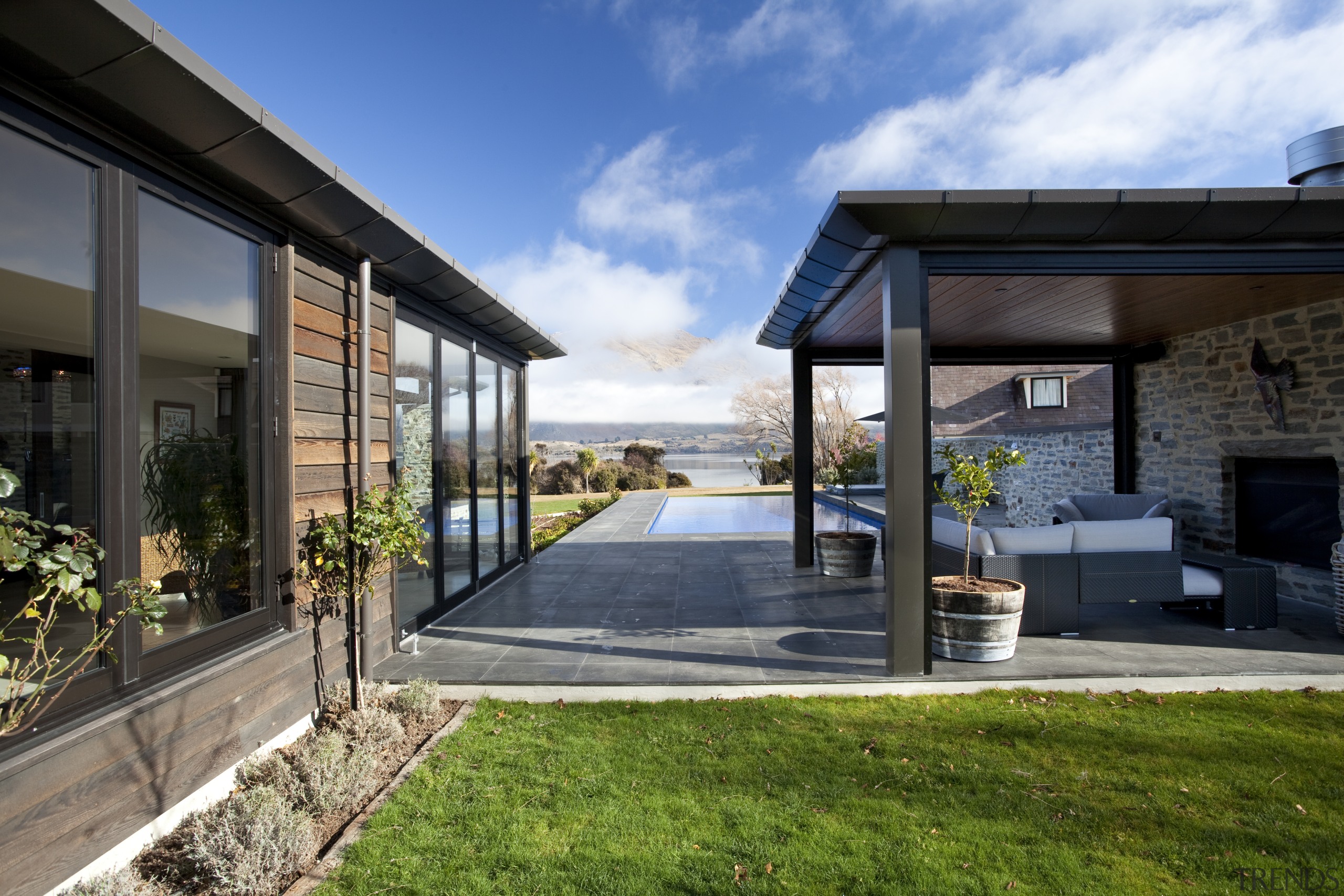 ​​​​​​​Covered loggias provide shelter from the harsh heat architecture, backyard, cottage, estate, home, house, property, real estate, residential area, black