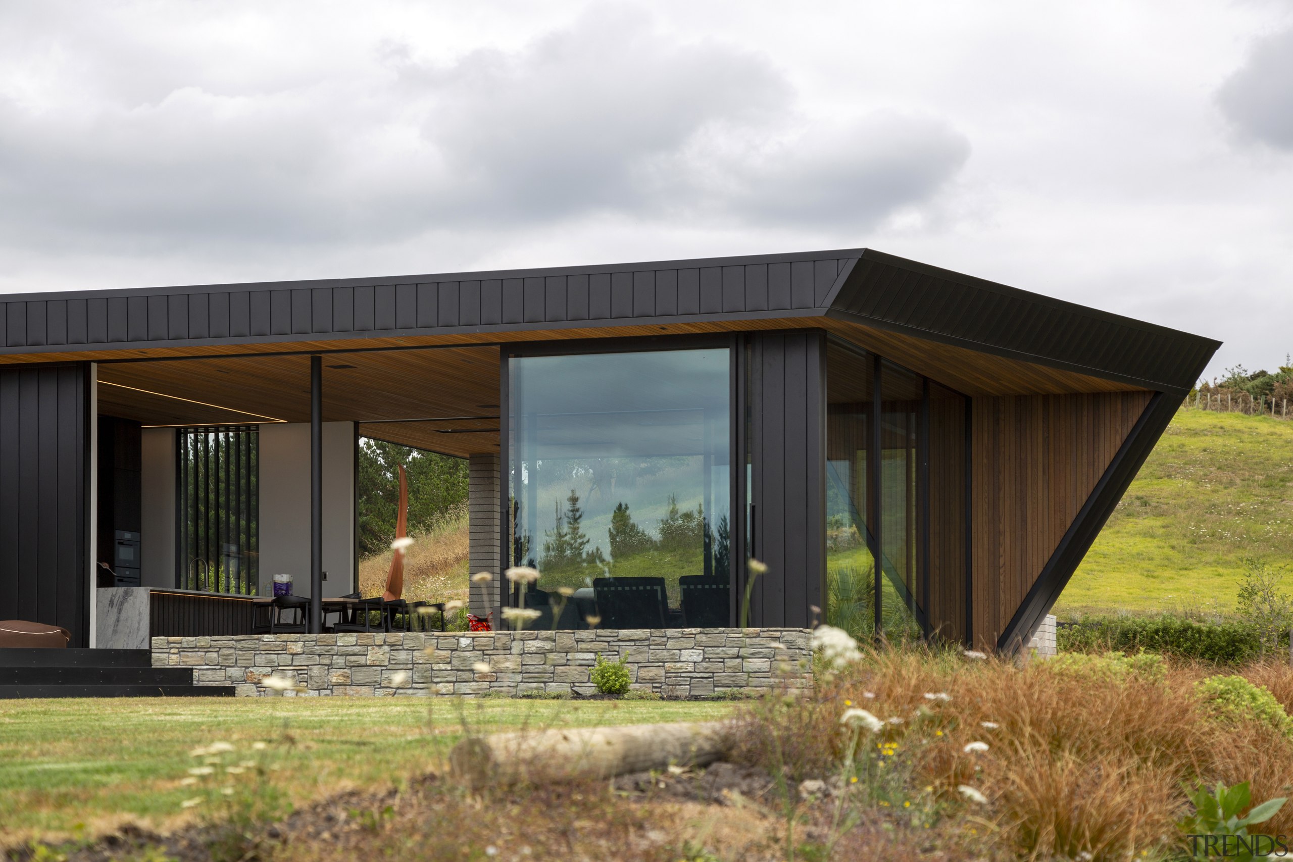 The restrained material palette of concrete, cedar and 