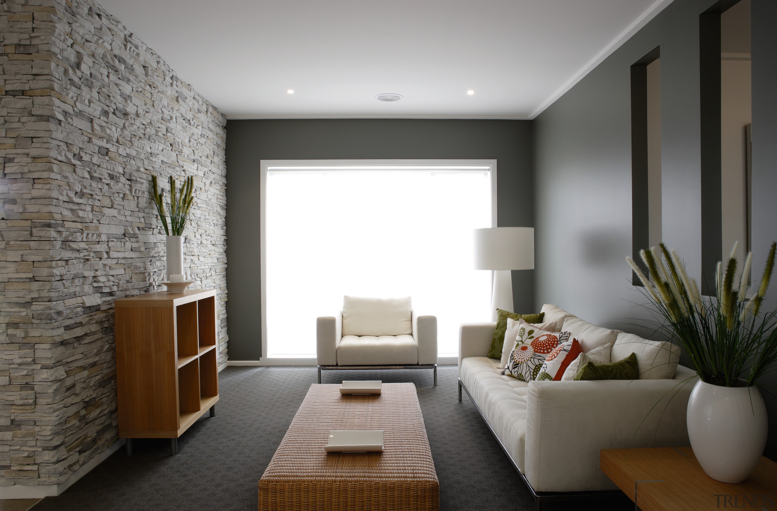 Lounge room with cream sofas, stone wall and ceiling, interior design, living room, room, gray, black