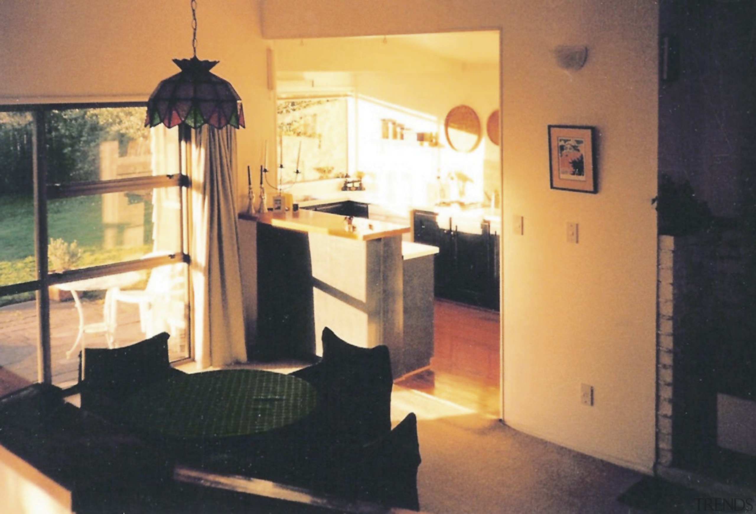 A view of the kitchen and dining areas furniture, home, house, interior design, lighting, property, room, table, window, orange, black