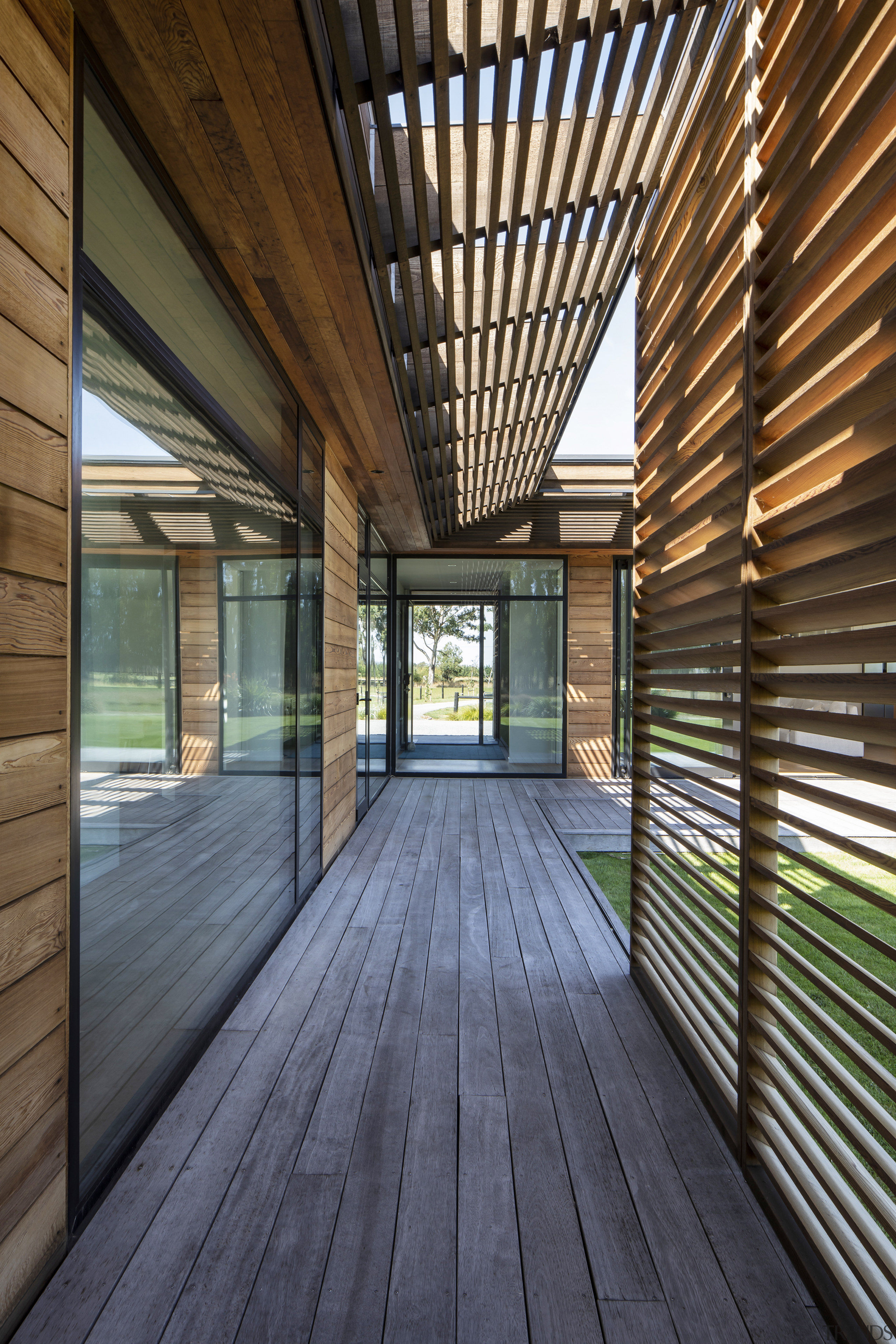 Cedar screens contrast the silvered timber walkways and 