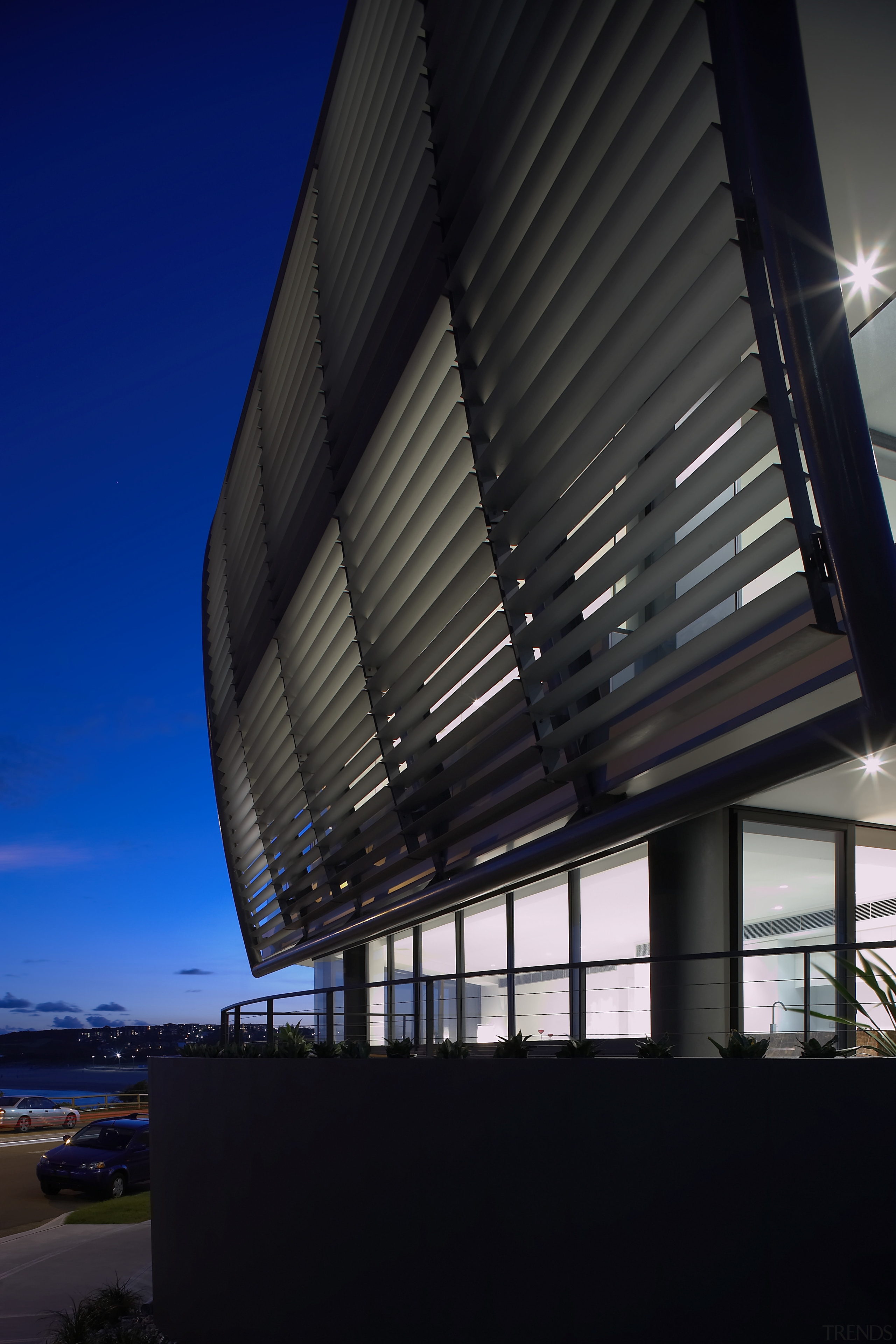 Exterior view of a Sydney apartment building which architecture, building, corporate headquarters, daylighting, daytime, facade, headquarters, house, line, metropolitan area, reflection, roof, sky, structure, black, blue