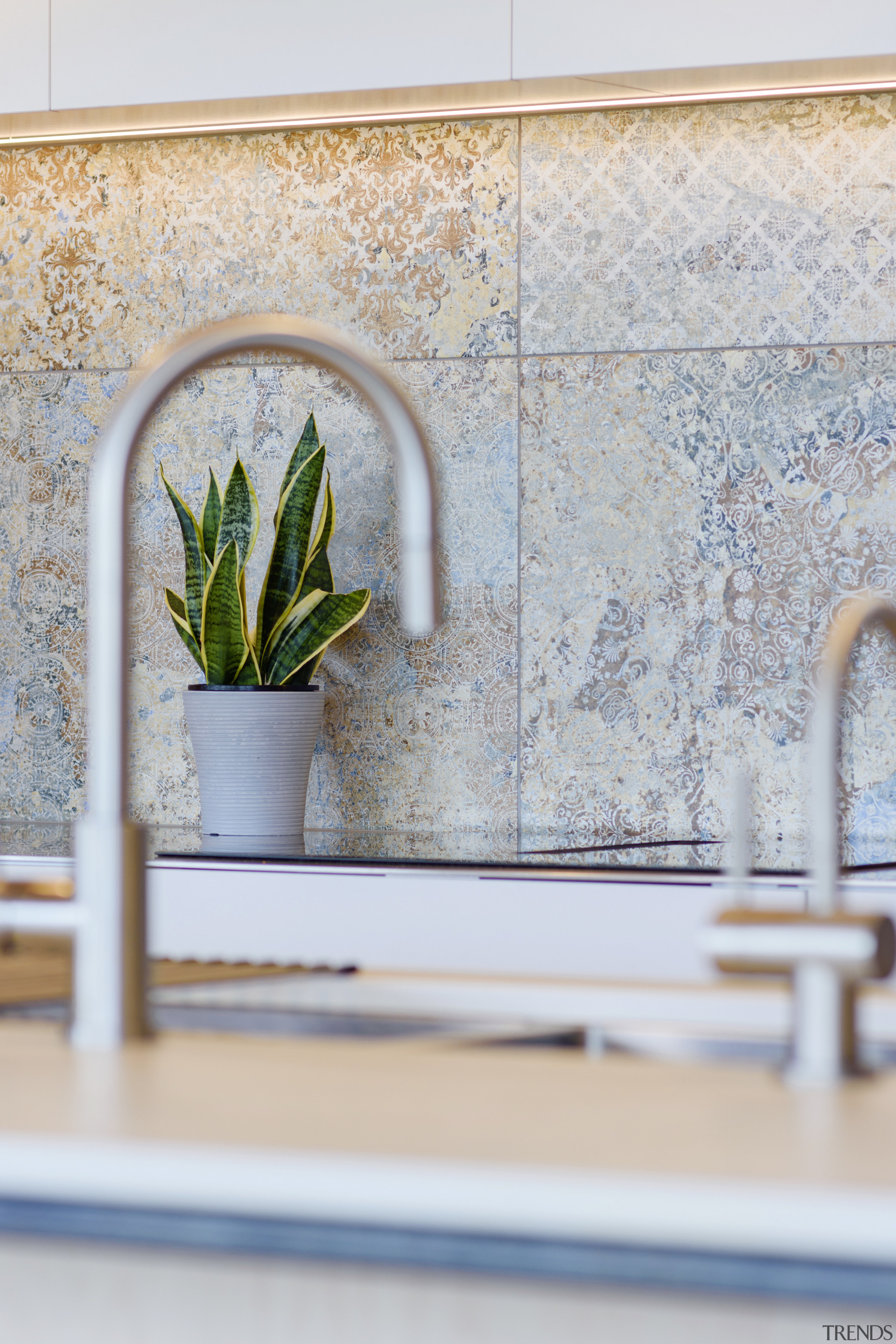 The kitchen's Caesarstone benchtop is accompanied by efficient 