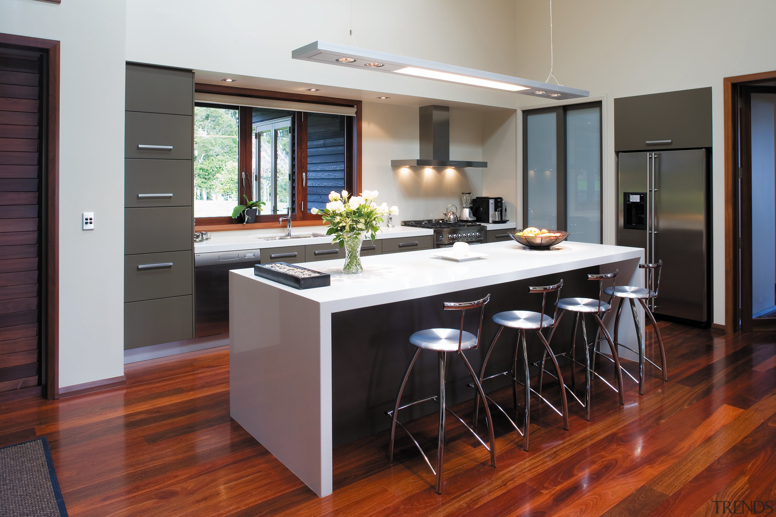 A view of some cabinetry by Carlielle Kitchens. cabinetry, countertop, floor, flooring, hardwood, interior design, kitchen, laminate flooring, real estate, room, wood flooring, black, gray