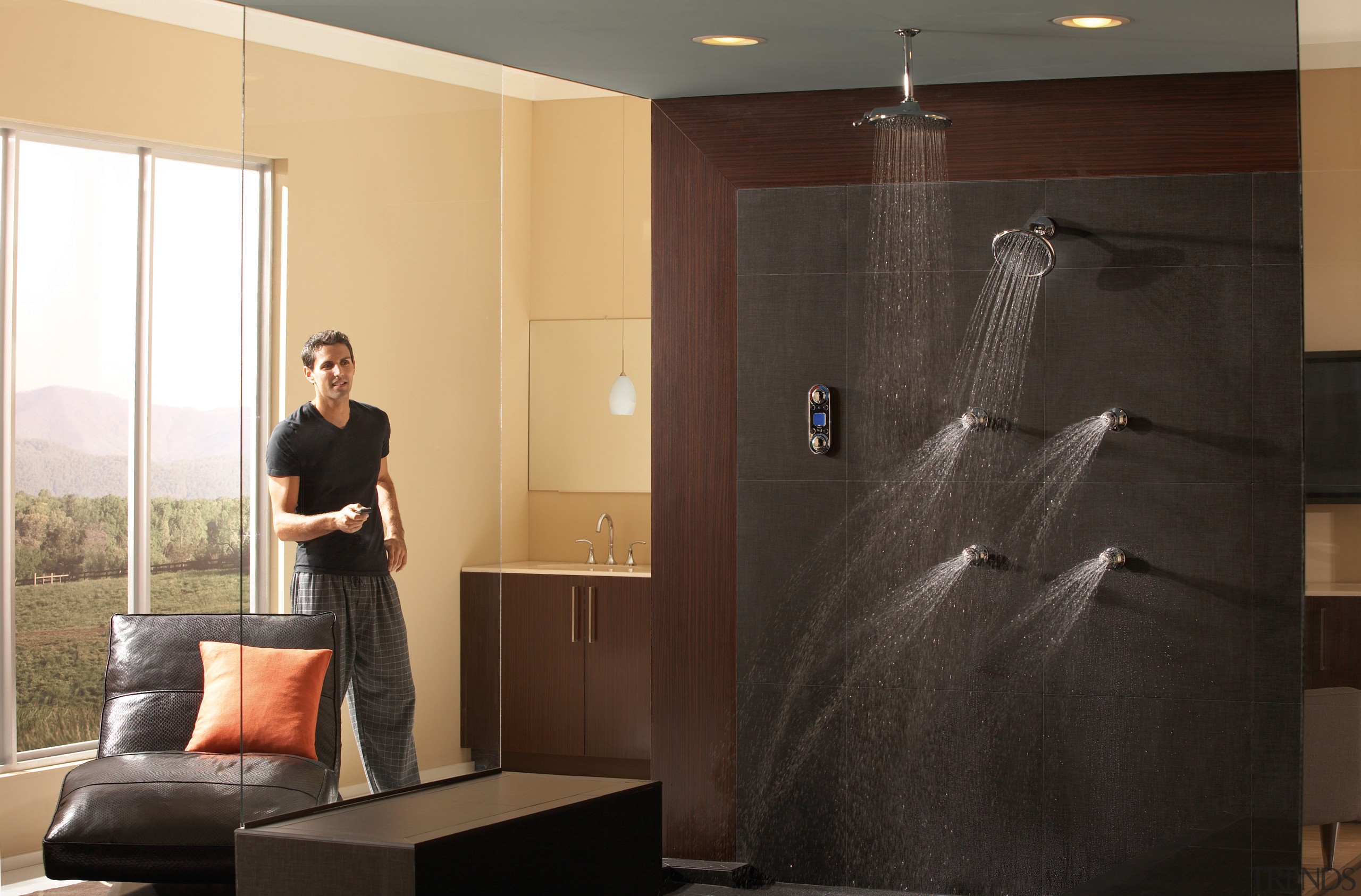 View of a shower enclosure which features several ceiling, floor, flooring, furniture, interior design, room, wall, black