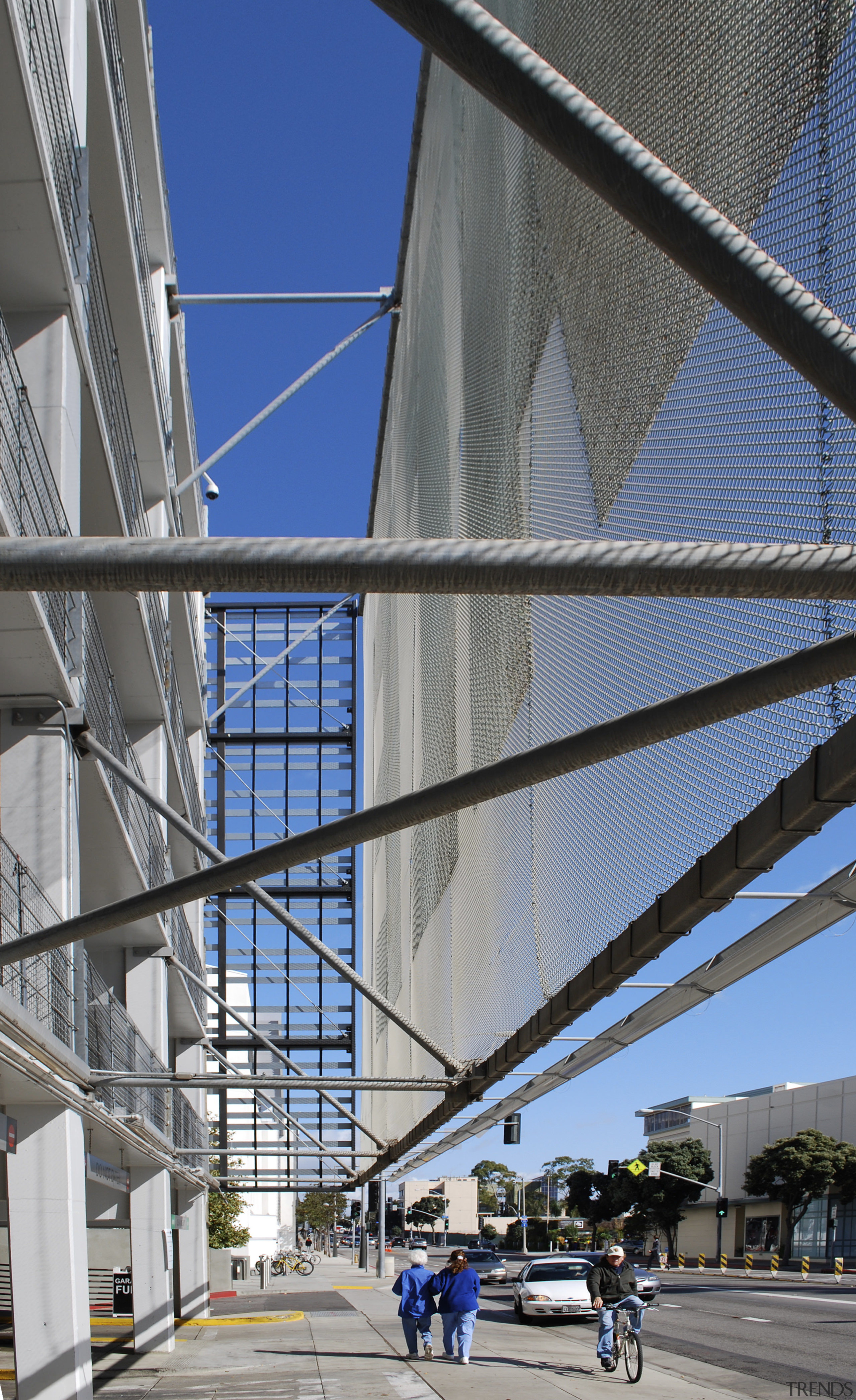 Close up of structure of parking building. - architecture, building, corporate headquarters, daylighting, daytime, facade, fixed link, line, metropolis, metropolitan area, sky, skyway, structure, urban area, gray