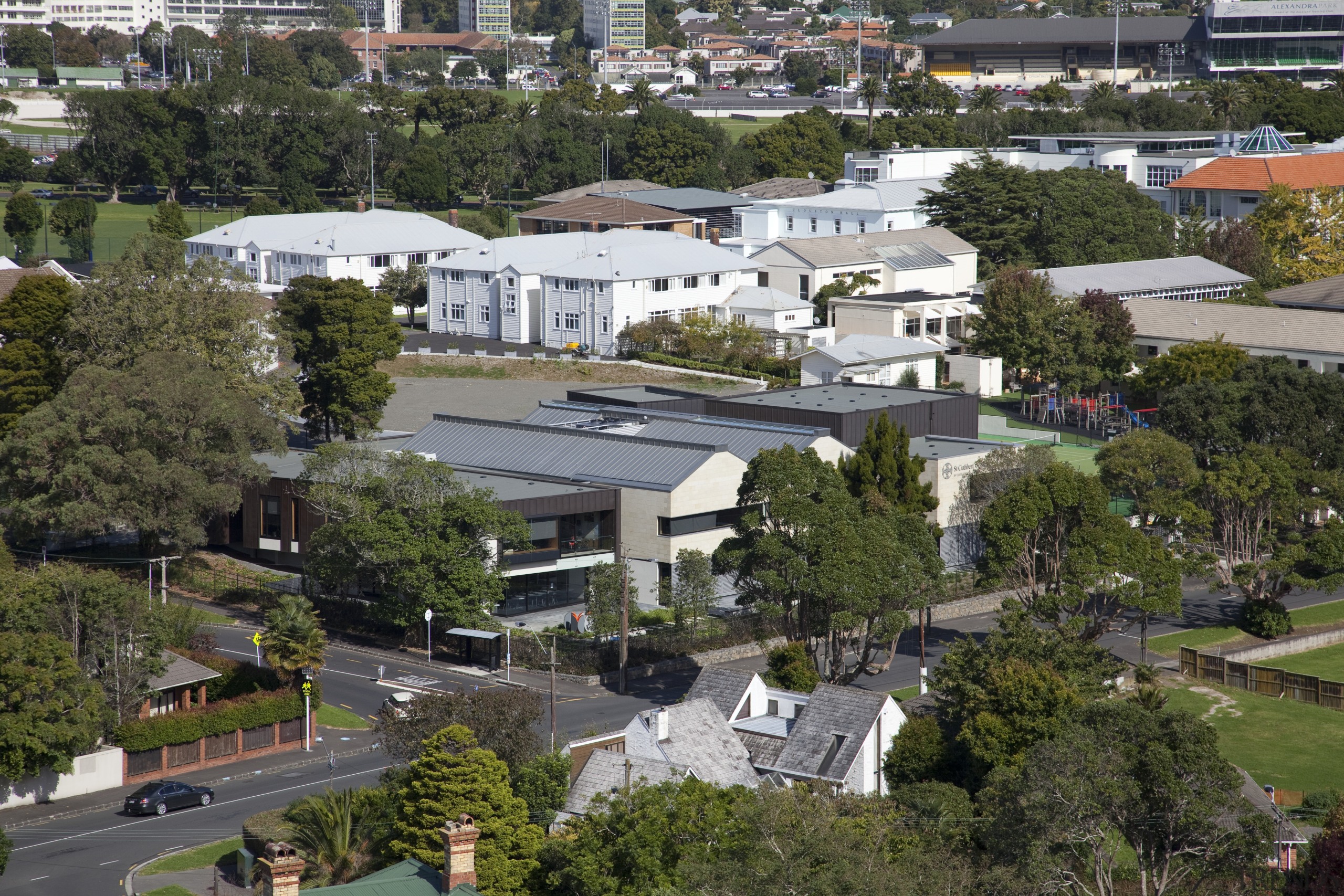 View of building from above. - View of aerial photography, bird's eye view, city, estate, home, house, mixed use, neighbourhood, property, real estate, residential area, roof, suburb, tree, urban area, urban design, brown