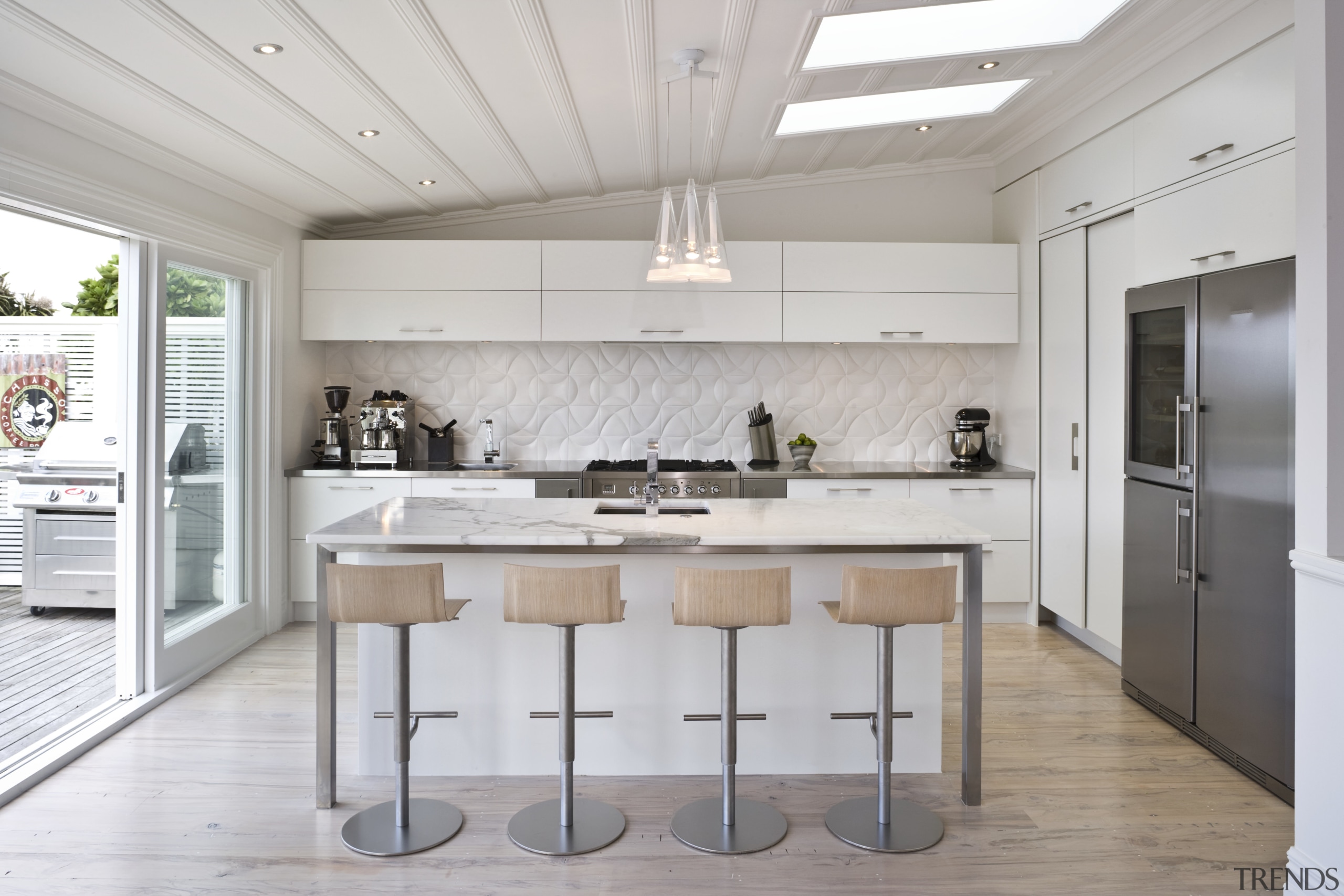 View of the kitchen and dining room where countertop, cuisine classique, floor, flooring, interior design, kitchen, real estate, gray