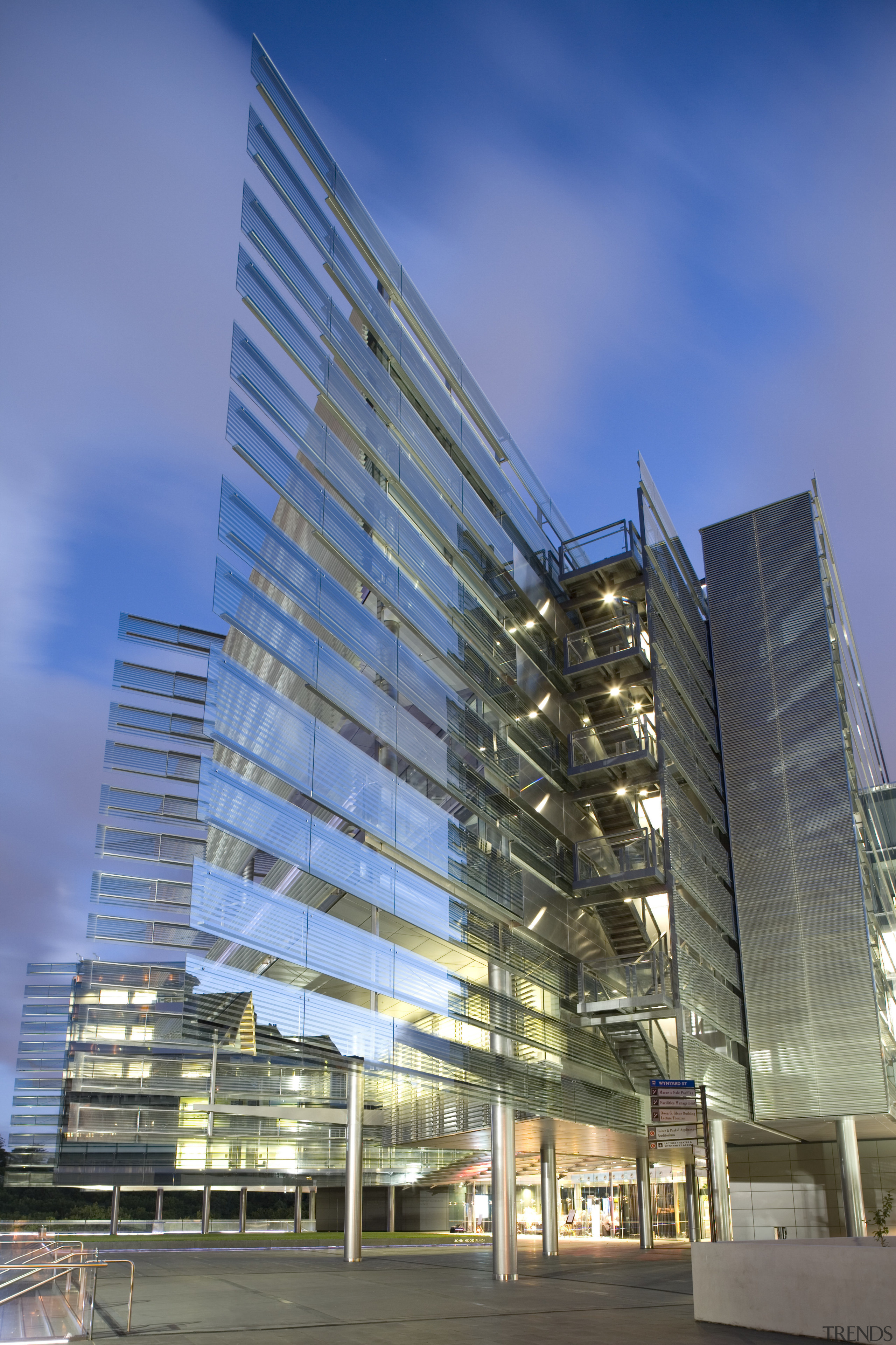 View of the exterior of the Owen G architecture, building, city, commercial building, condominium, corporate headquarters, daytime, facade, headquarters, metropolis, metropolitan area, mixed use, reflection, residential area, sky, skyscraper, tower block, urban area, blue