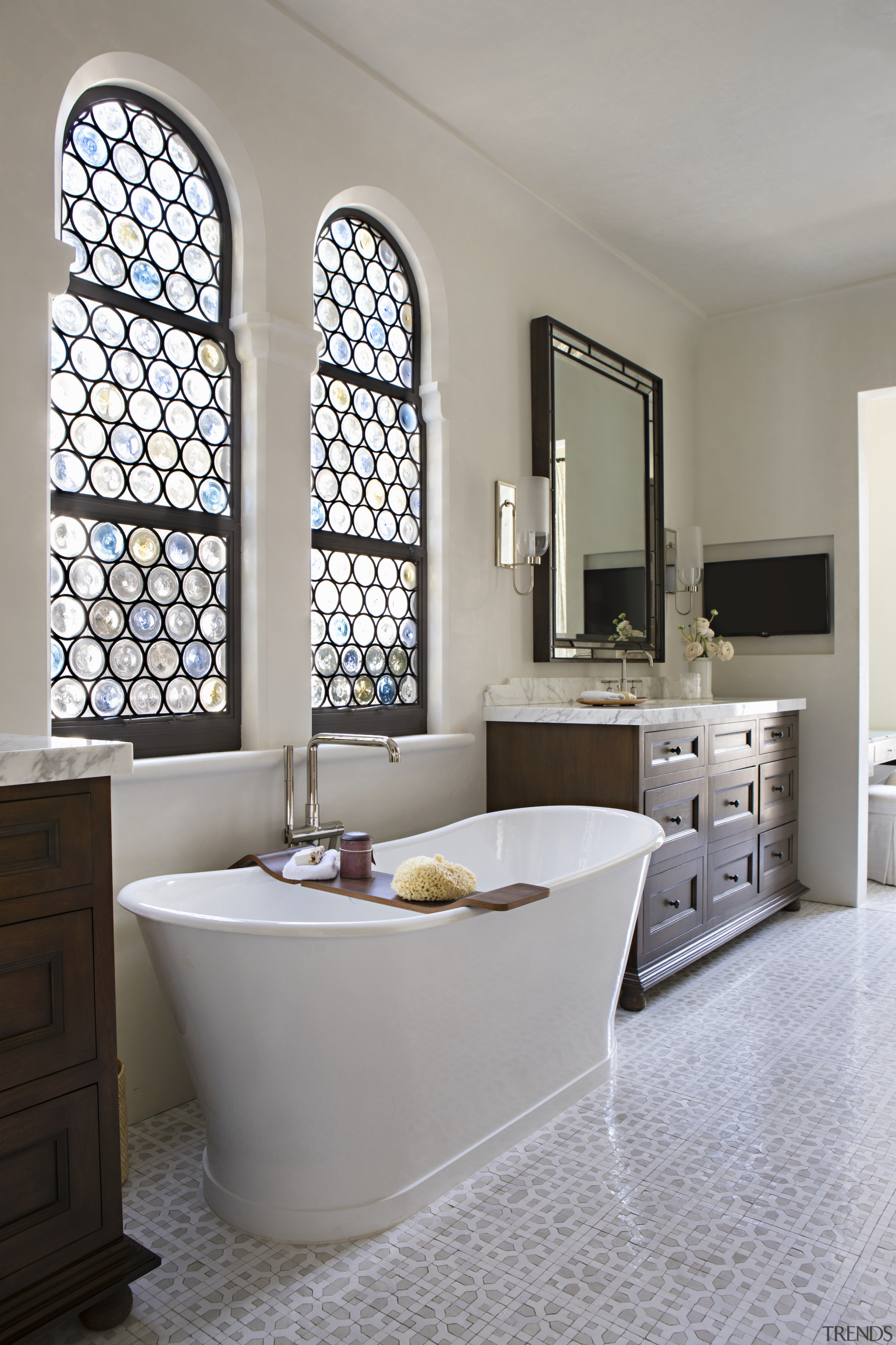 The master bathroom includes a freestanding slipper bath. 