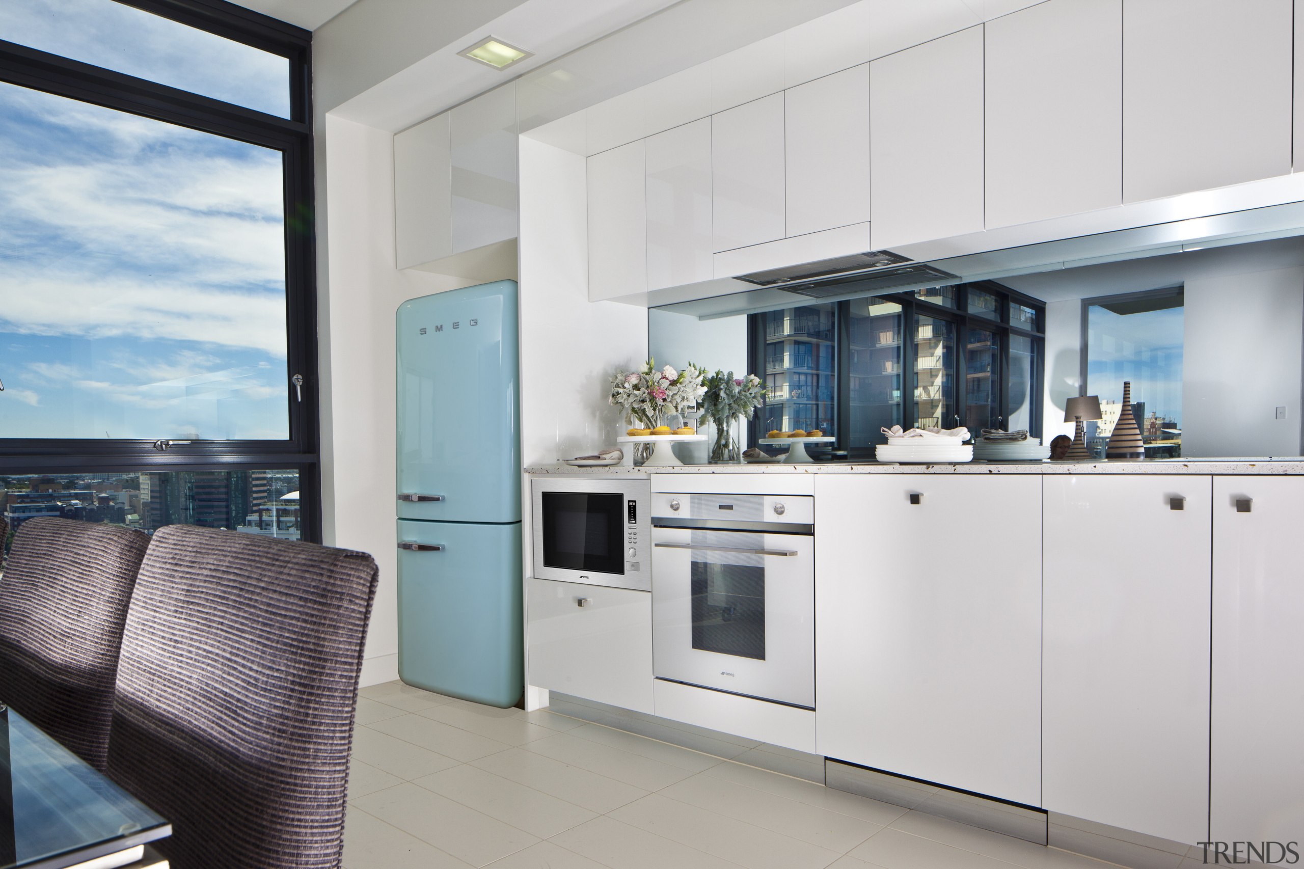 kitchen featuring smeg appliances, retro fridge, oven and home appliance, interior design, kitchen, real estate, gray