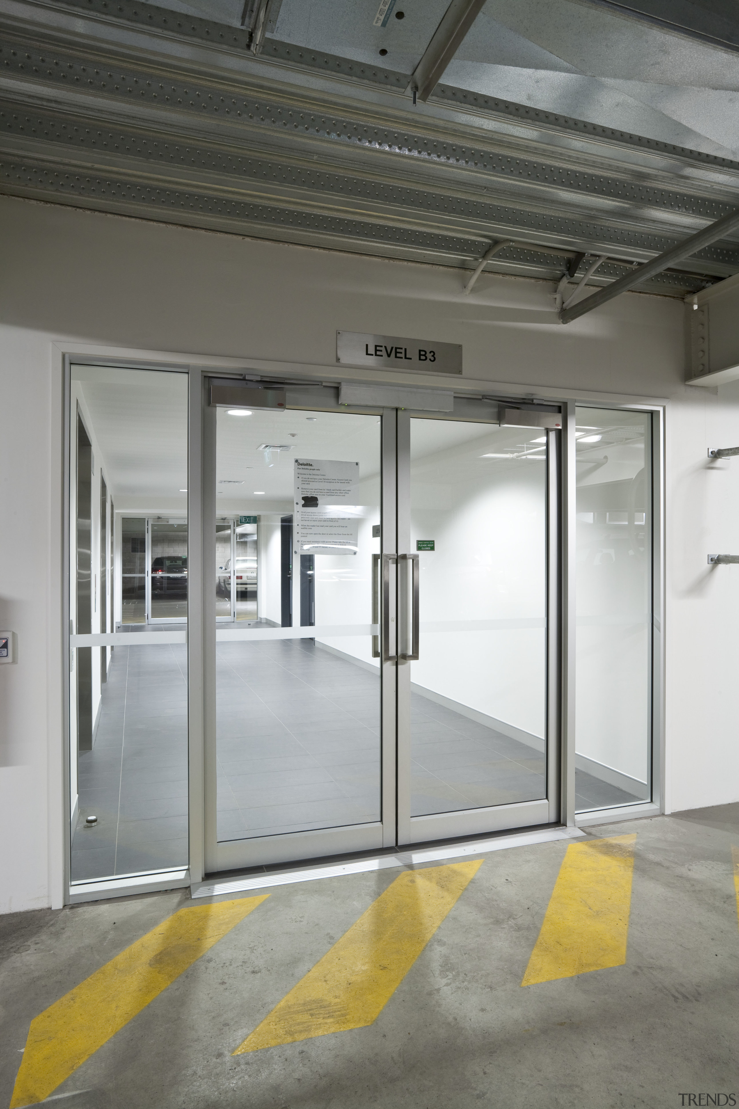 View of the basement carpark at 80 Queen door, floor, glass, gray