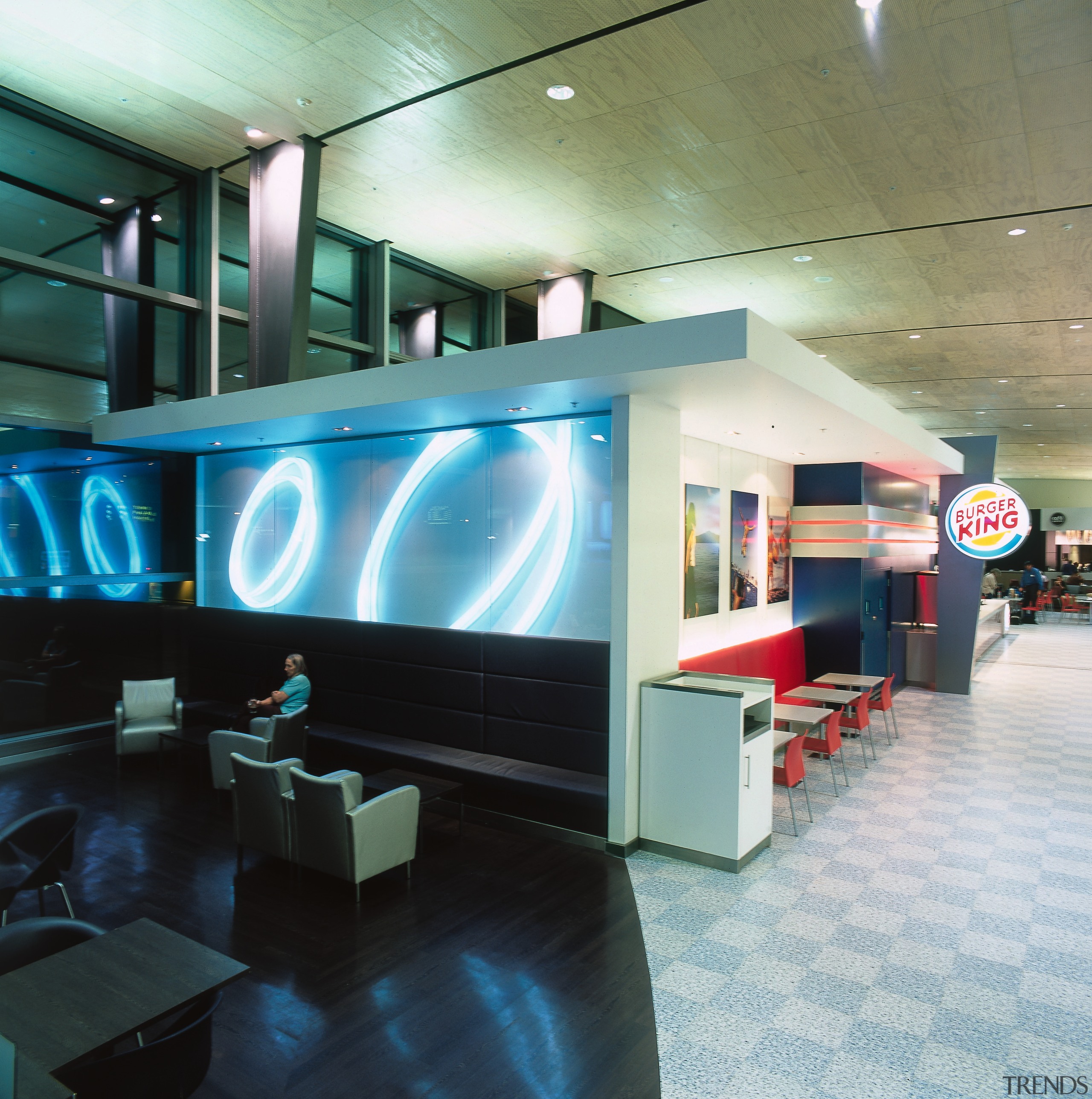 Burger King store with seating and lighting display. interior design, lobby, black
