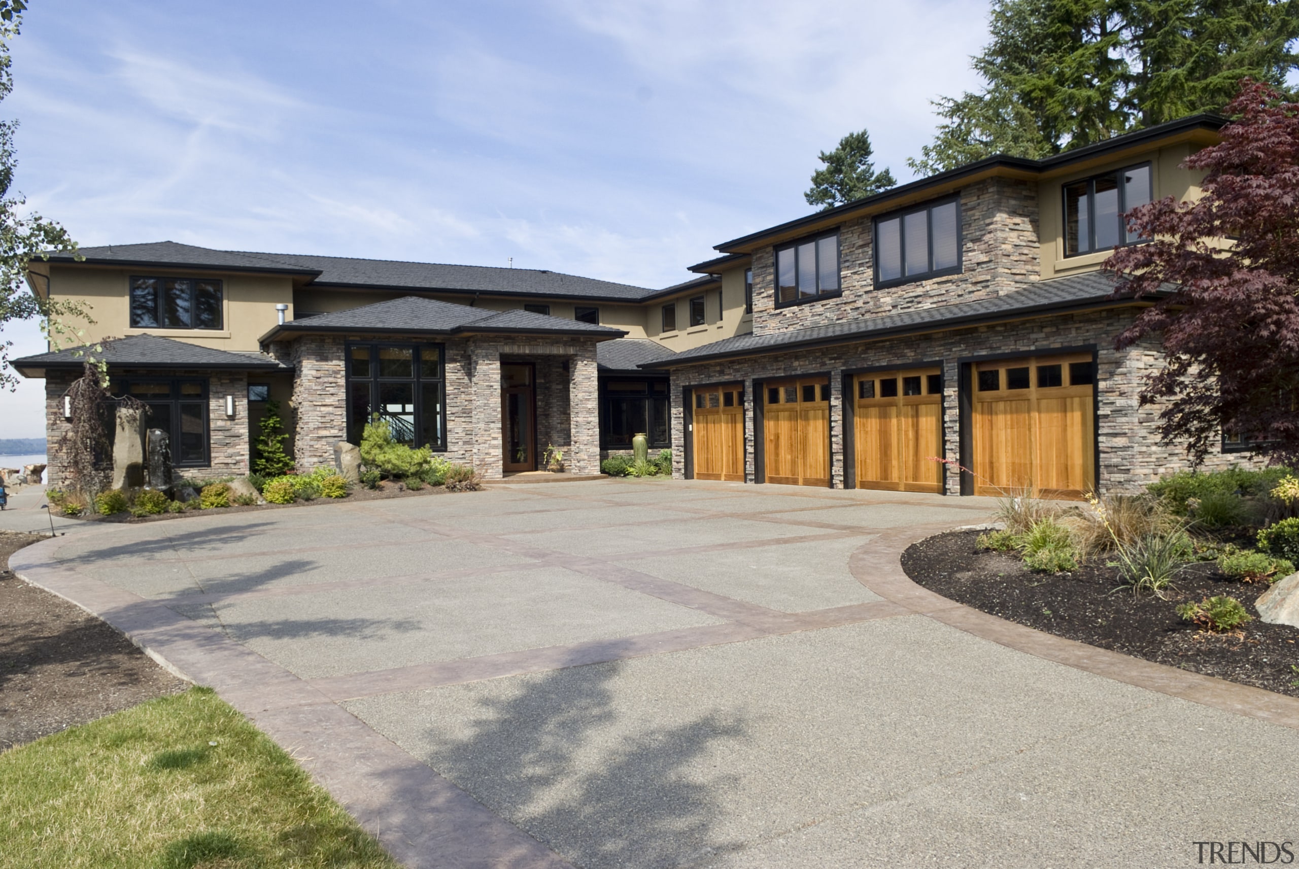 exterior view of a house which features custom cottage, driveway, estate, facade, home, house, landscape, mansion, property, real estate, residential area, gray