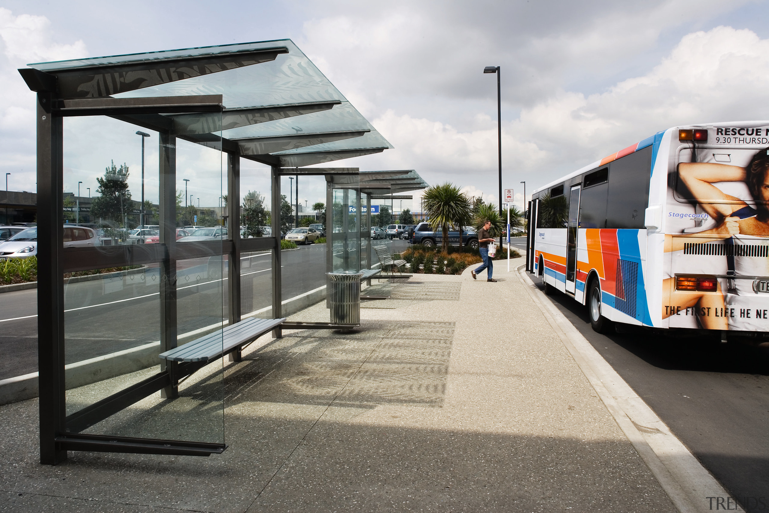 A view of the raoding by Flow Transportation bus stop, public space, transport, vehicle, white, gray