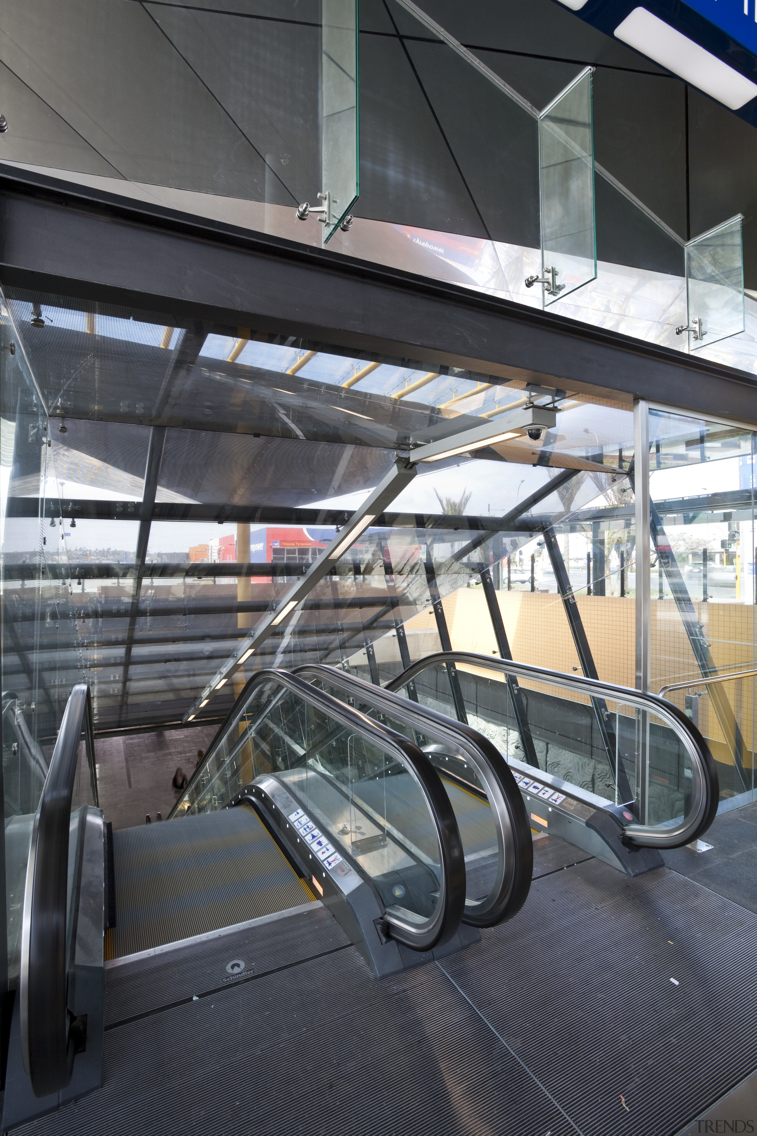 View of the renovated New Lynn Railway Station architecture, building, escalator, glass, metropolitan area, motor vehicle, public transport, structure, transport, black, gray