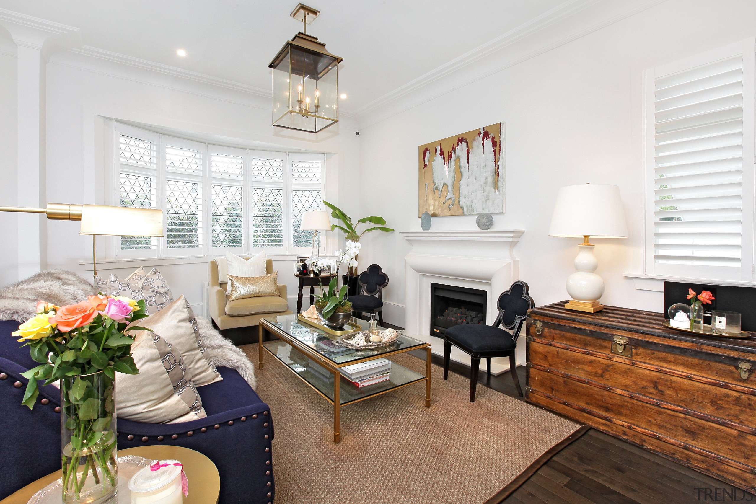 The main living space in this home comprehensively building, ceiling, coffee table, floor, flooring, furniture, hardwood, home, house, interior design, living room, property, real estate, room, table, wood flooring, white