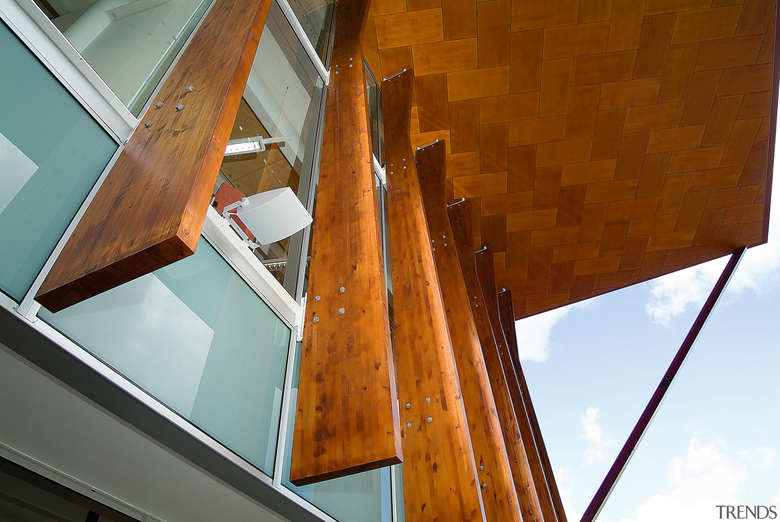 Exterior view of building showing timber fins, roof angle, architecture, beam, daylighting, glass, house, line, stairs, structure, wood, brown
