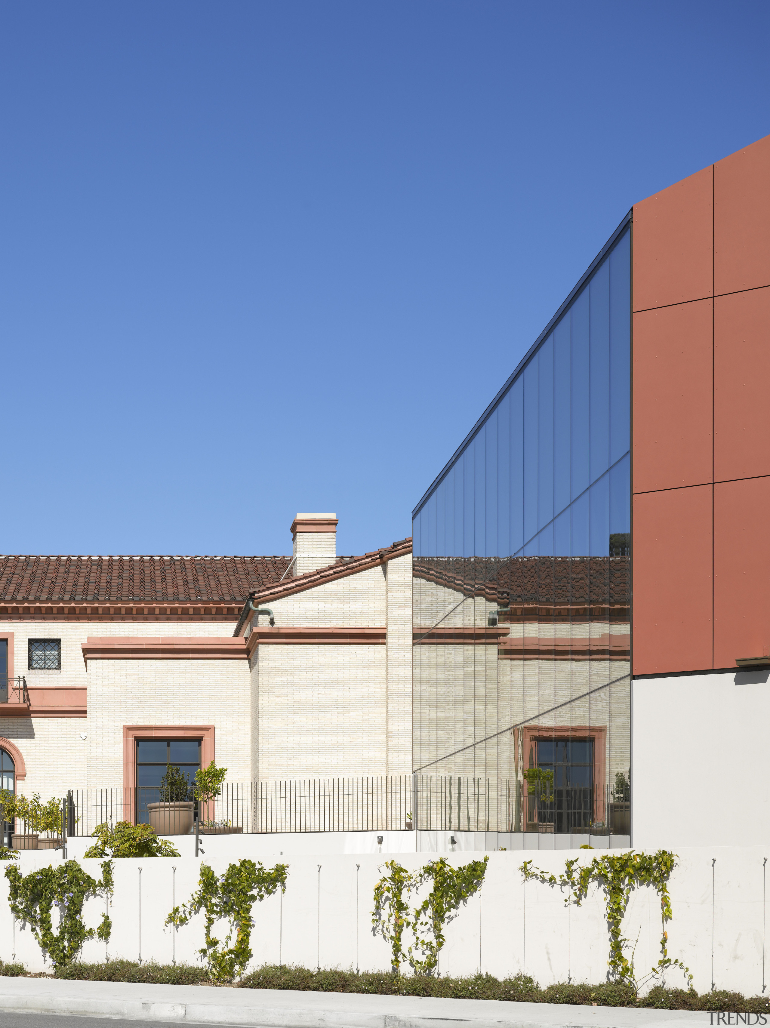 The new facade reflects the old in this architecture, building, commercial building, daytime, elevation, facade, home, house, line, neighbourhood, property, real estate, residential area, roof, sky, suburb, blue, white