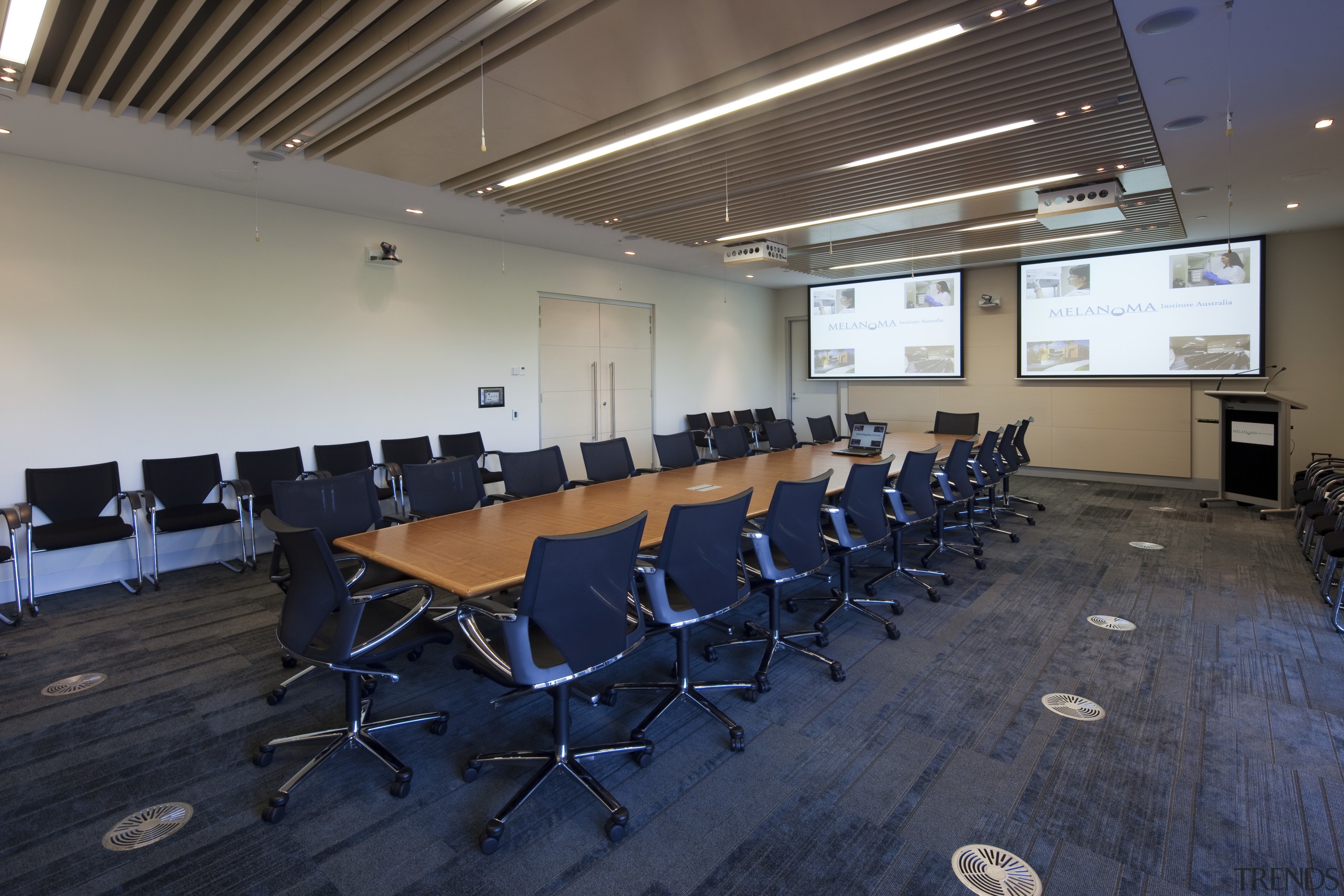 Interior view of the Poche Centre which features auditorium, classroom, conference hall, table, blue, gray