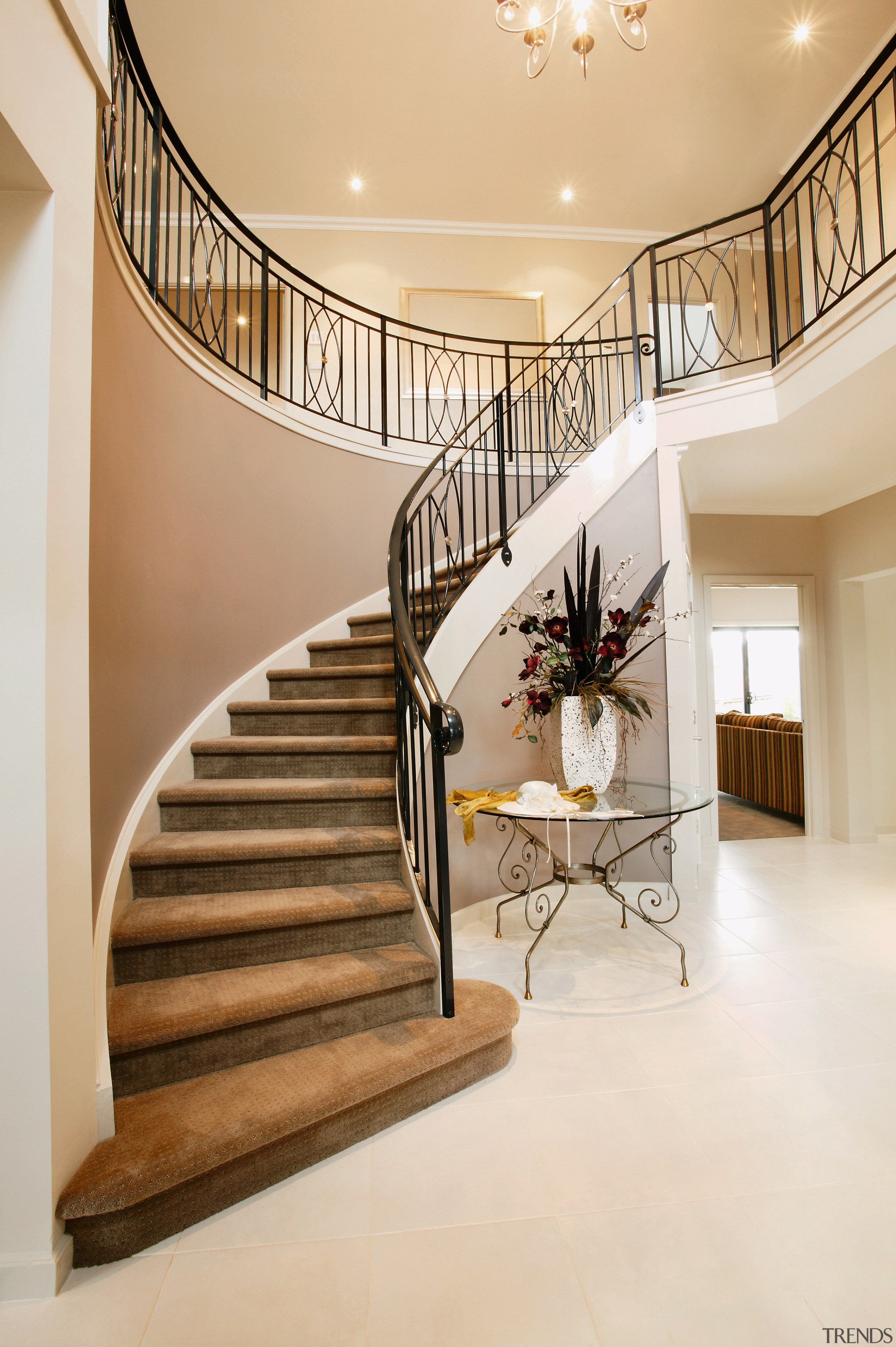 Curved stairway with wrought iron balustrade. - Curved baluster, ceiling, estate, floor, flooring, handrail, hardwood, home, interior design, lobby, real estate, stairs, white, orange