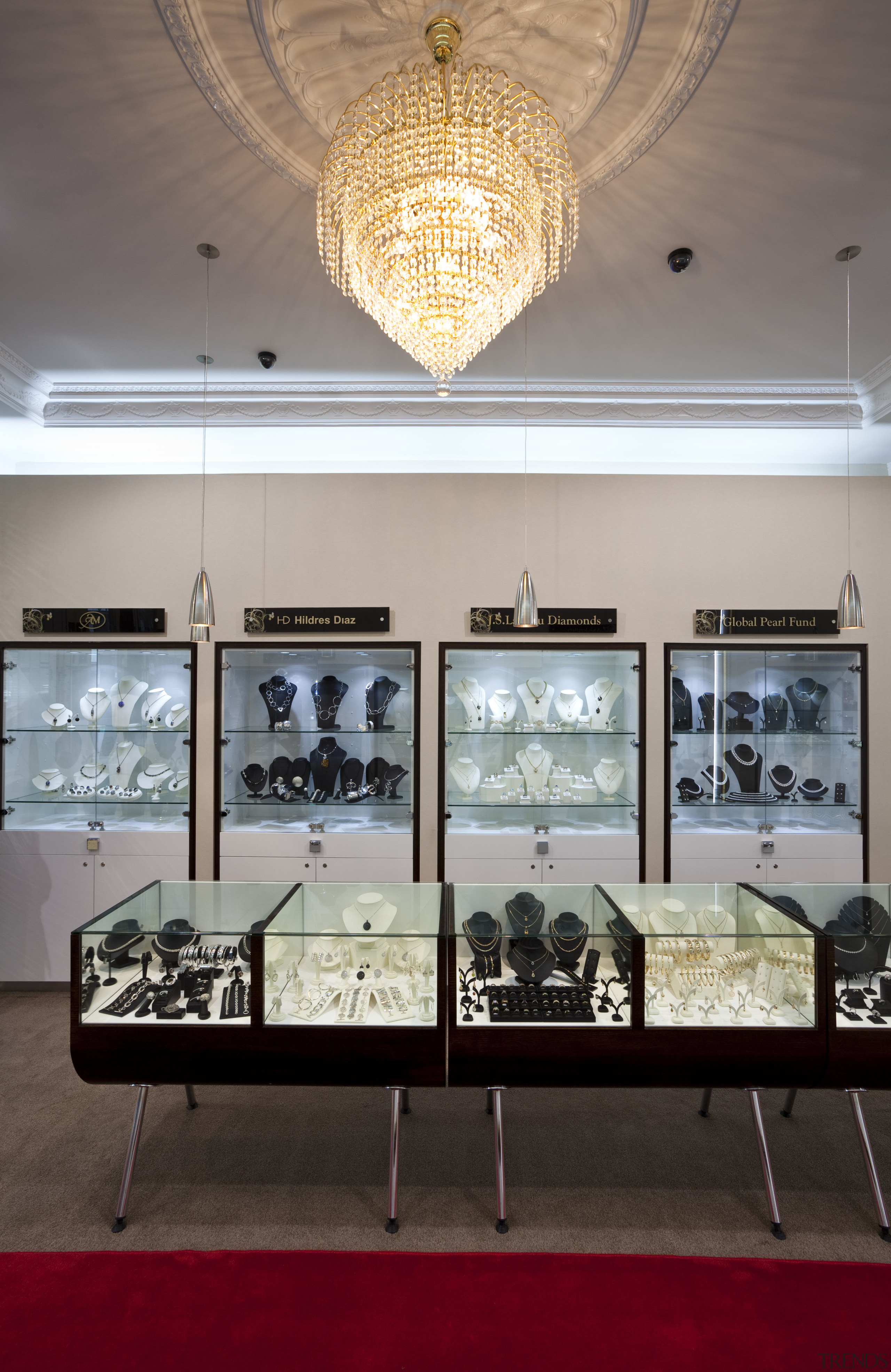 View of the Anna Webster Jeweler boutique.Features repeating ceiling, exhibition, furniture, interior design, table, tourist attraction, gray